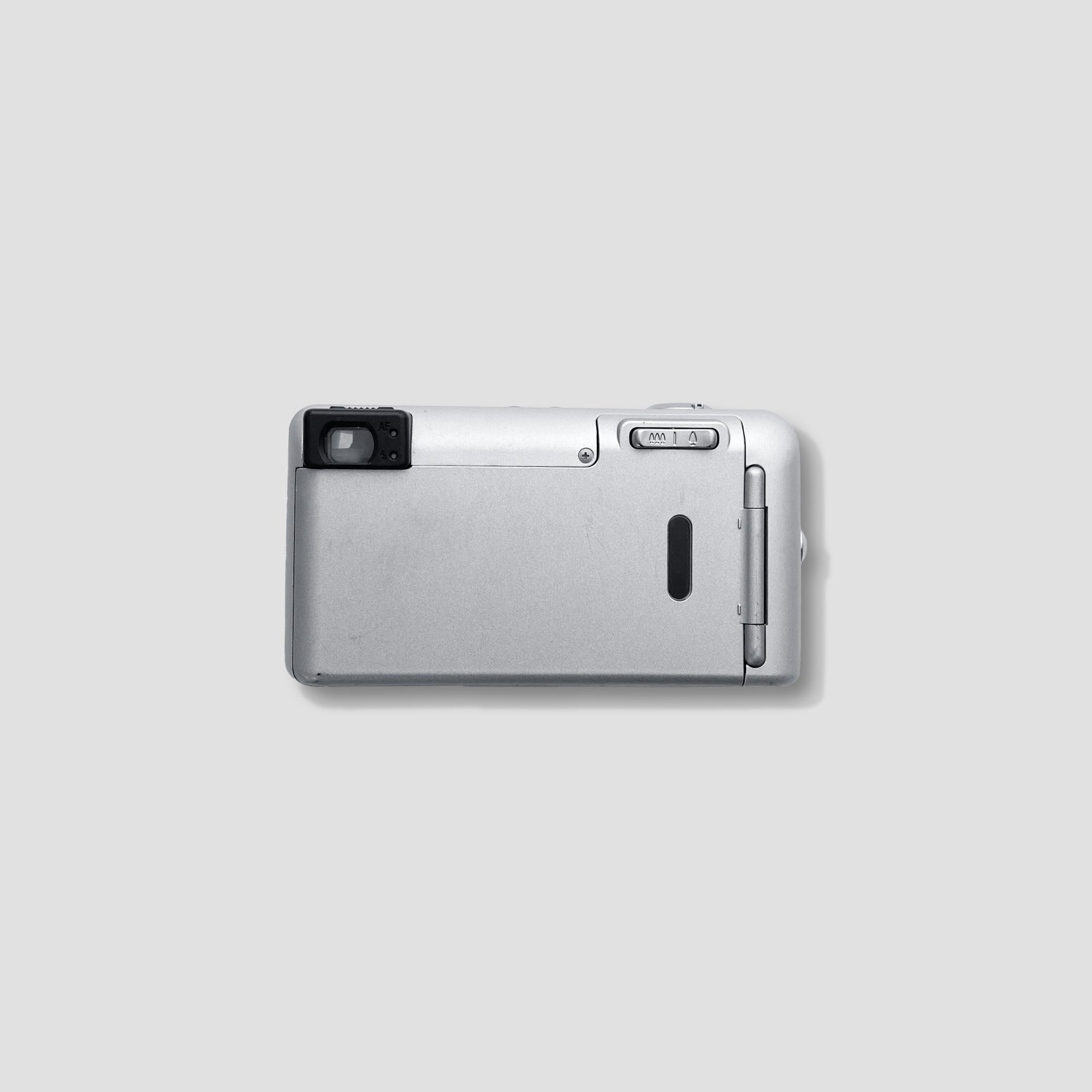 User holding the lightweight Pentax Espio 105SW for casual photography