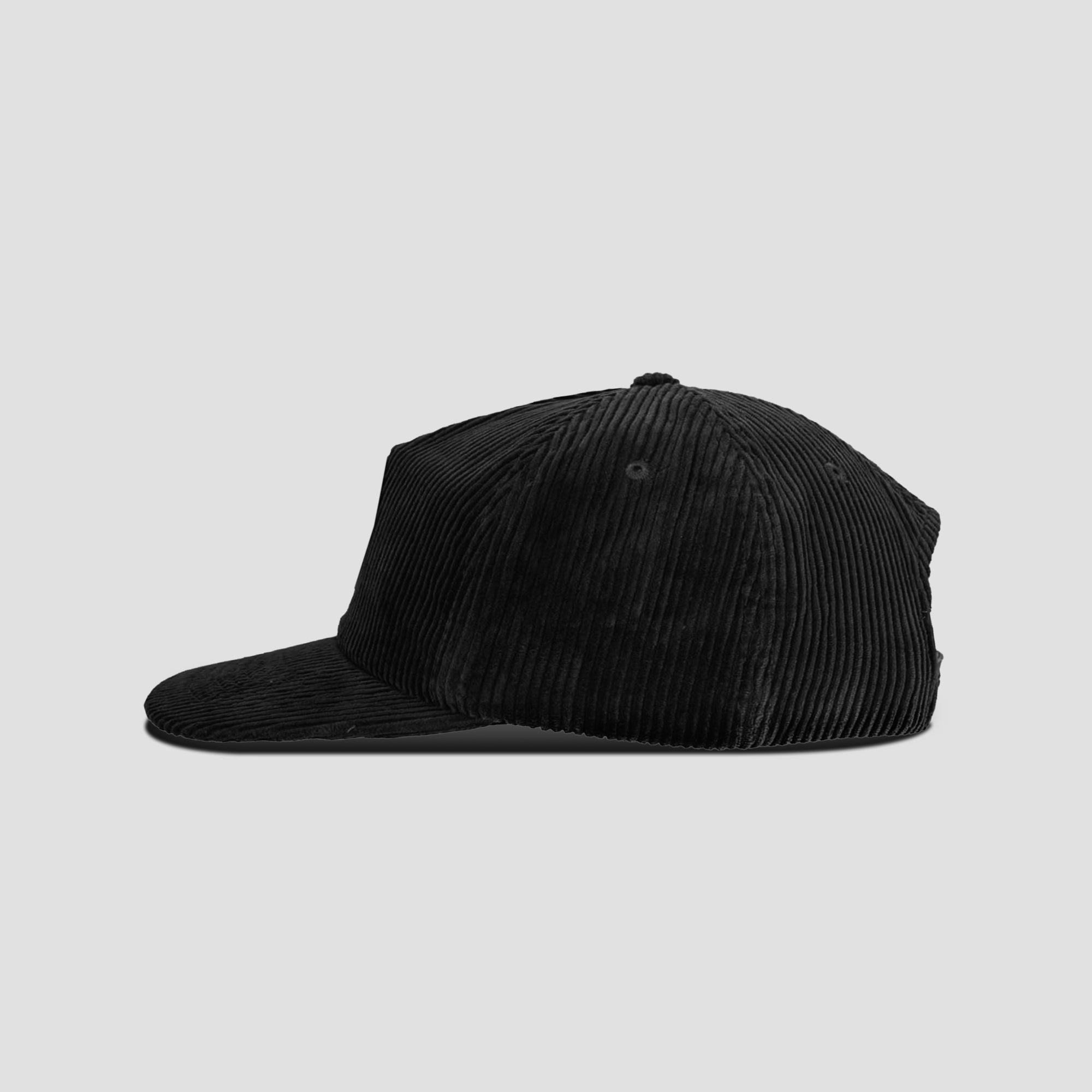 Close-up of embroidered logo on corduroy cap