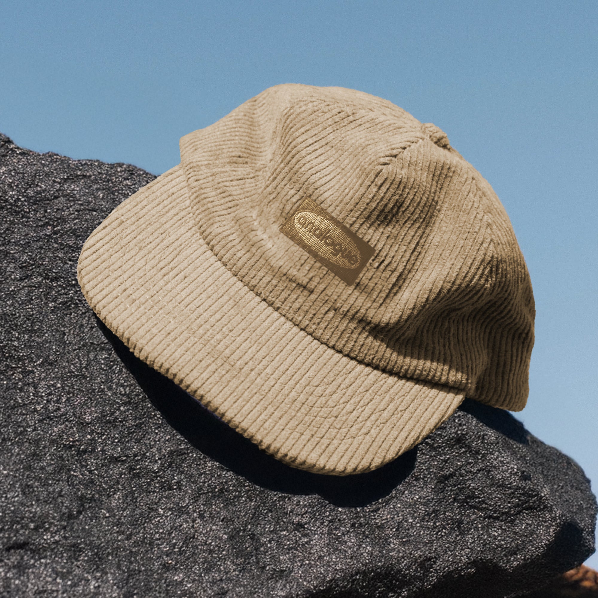 Front view of beige corduroy cap showing classic style and cozy fabric