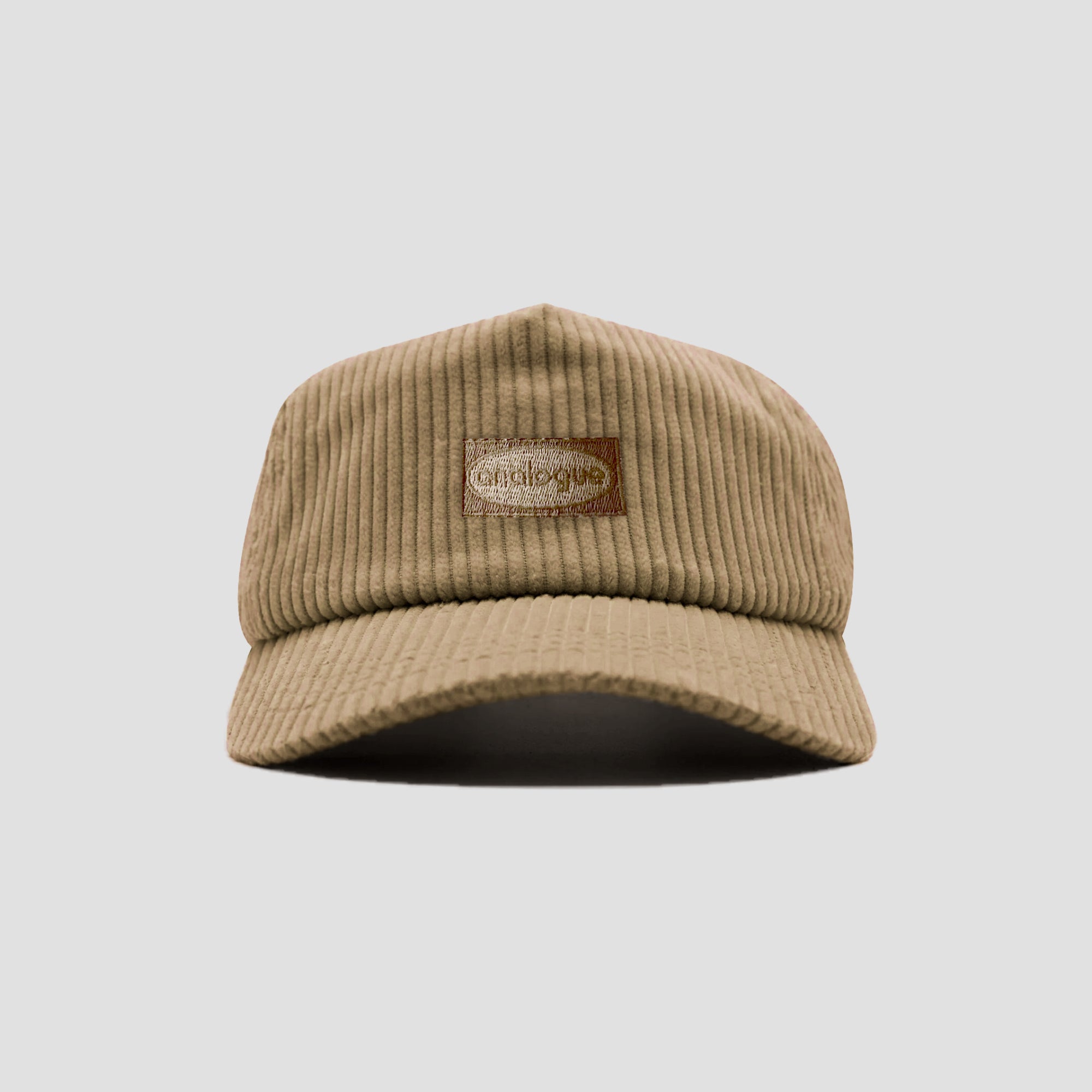 Front view of beige corduroy cap showing classic style and cozy fabric