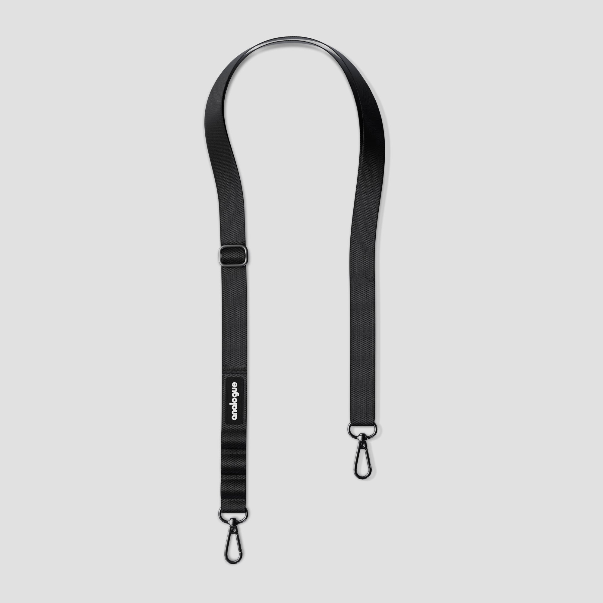Side view of the mini camera sling worn crossbody, showing its compact fit for small cameras