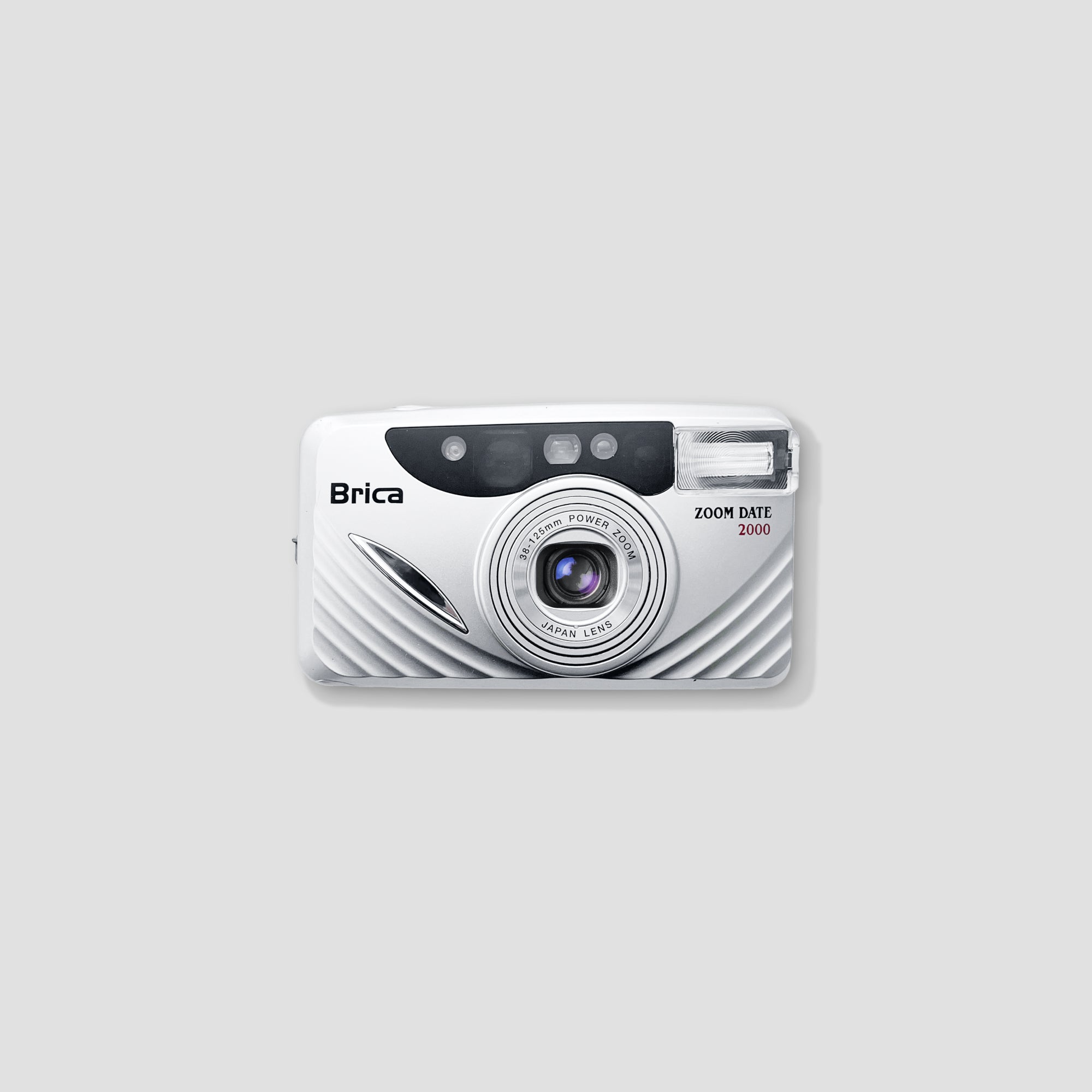 Front view of the Brica Zoom Date 2000 vintage film camera with retro styling