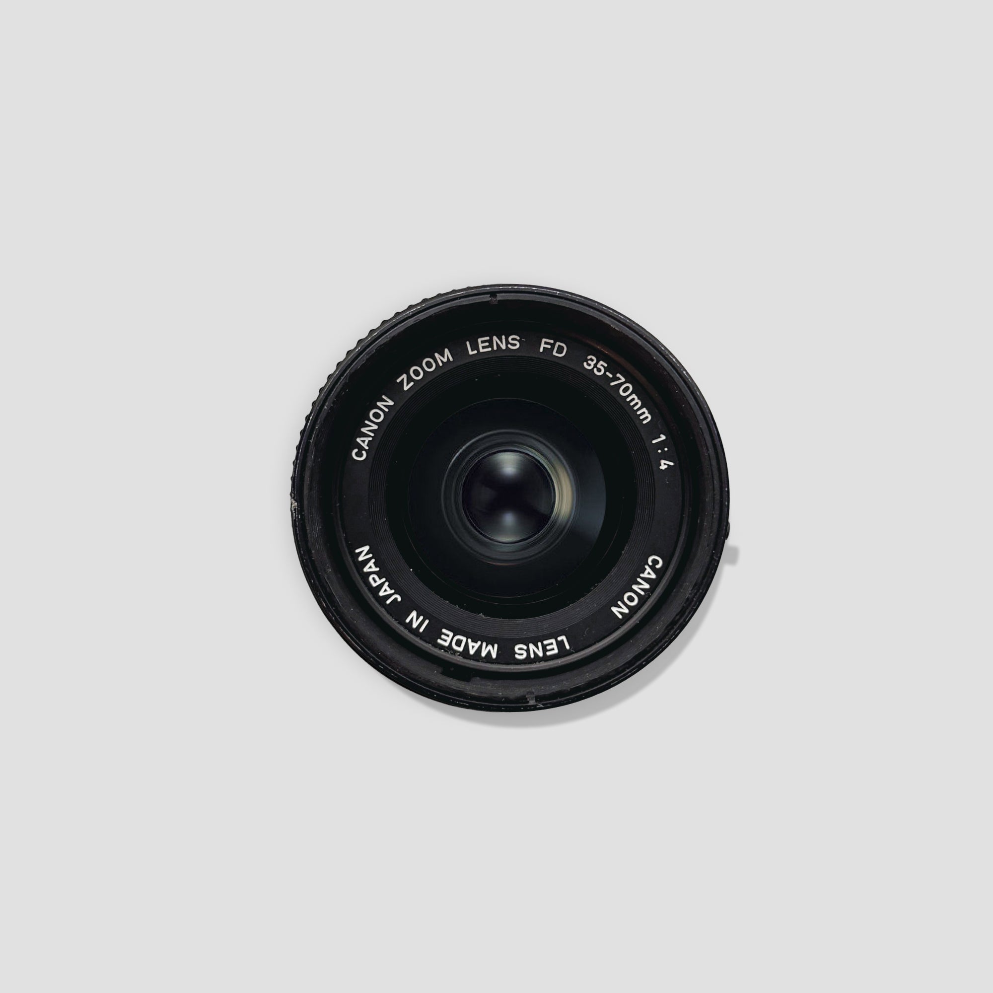 Canon FD 35-70mm lens showcasing its sleek design and zoom capabilities.