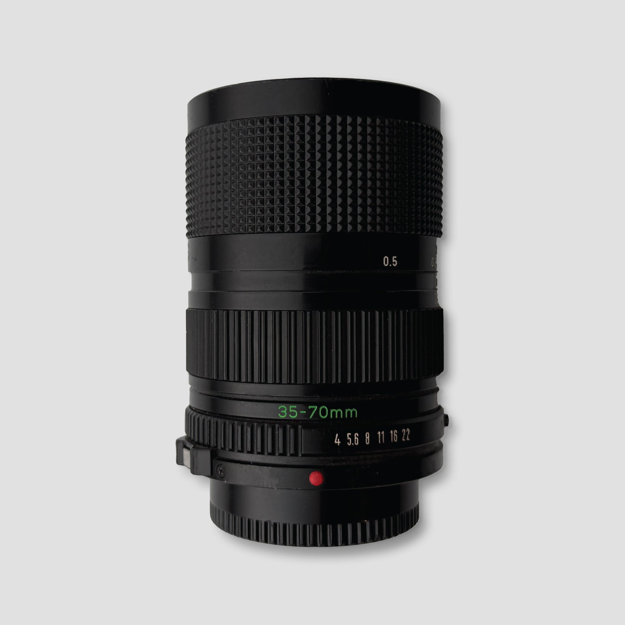 Photographer using the Canon FD zoom lens for capturing stunning landscapes.