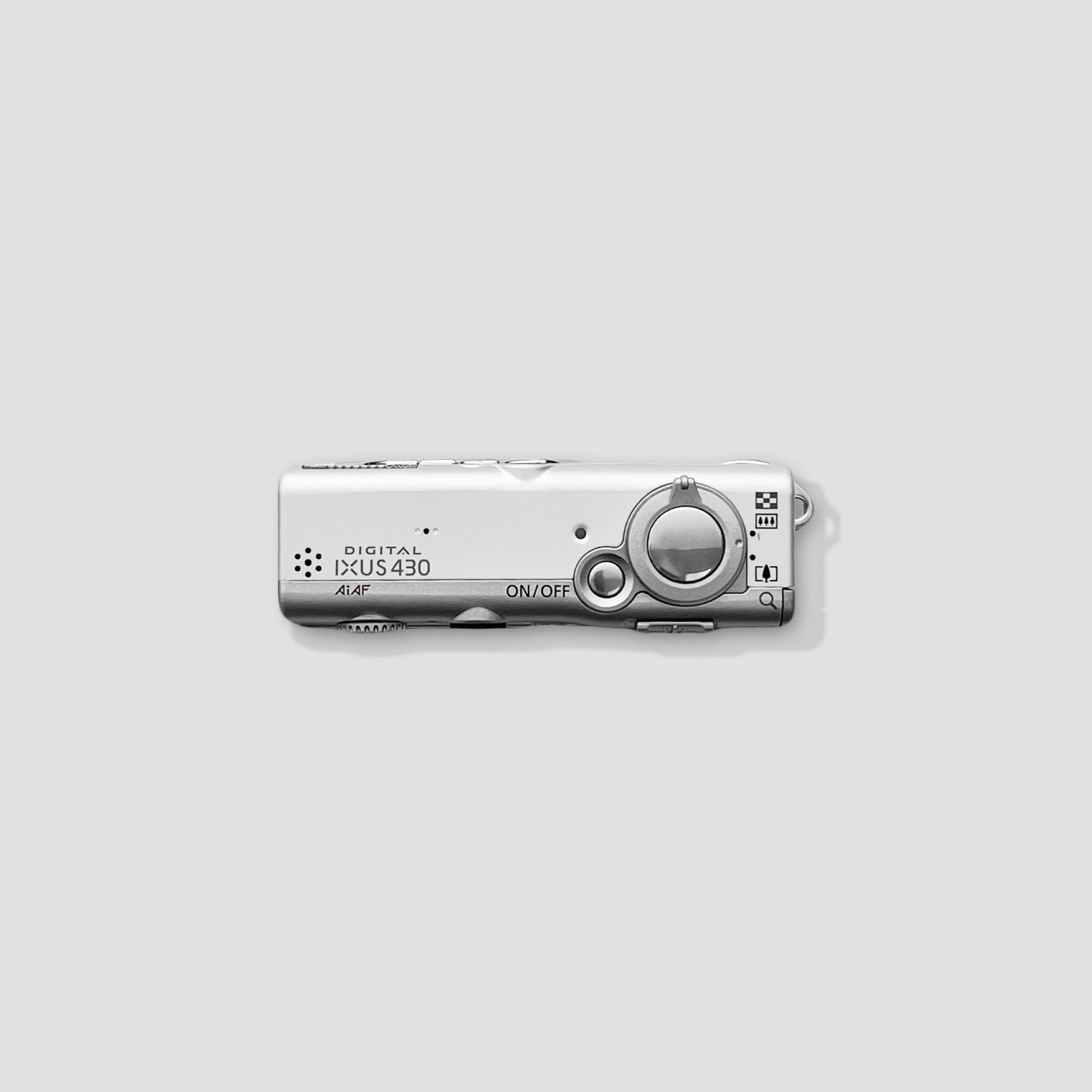 Close-up of the Canon IXUS 430 showing buttons and lens for easy use