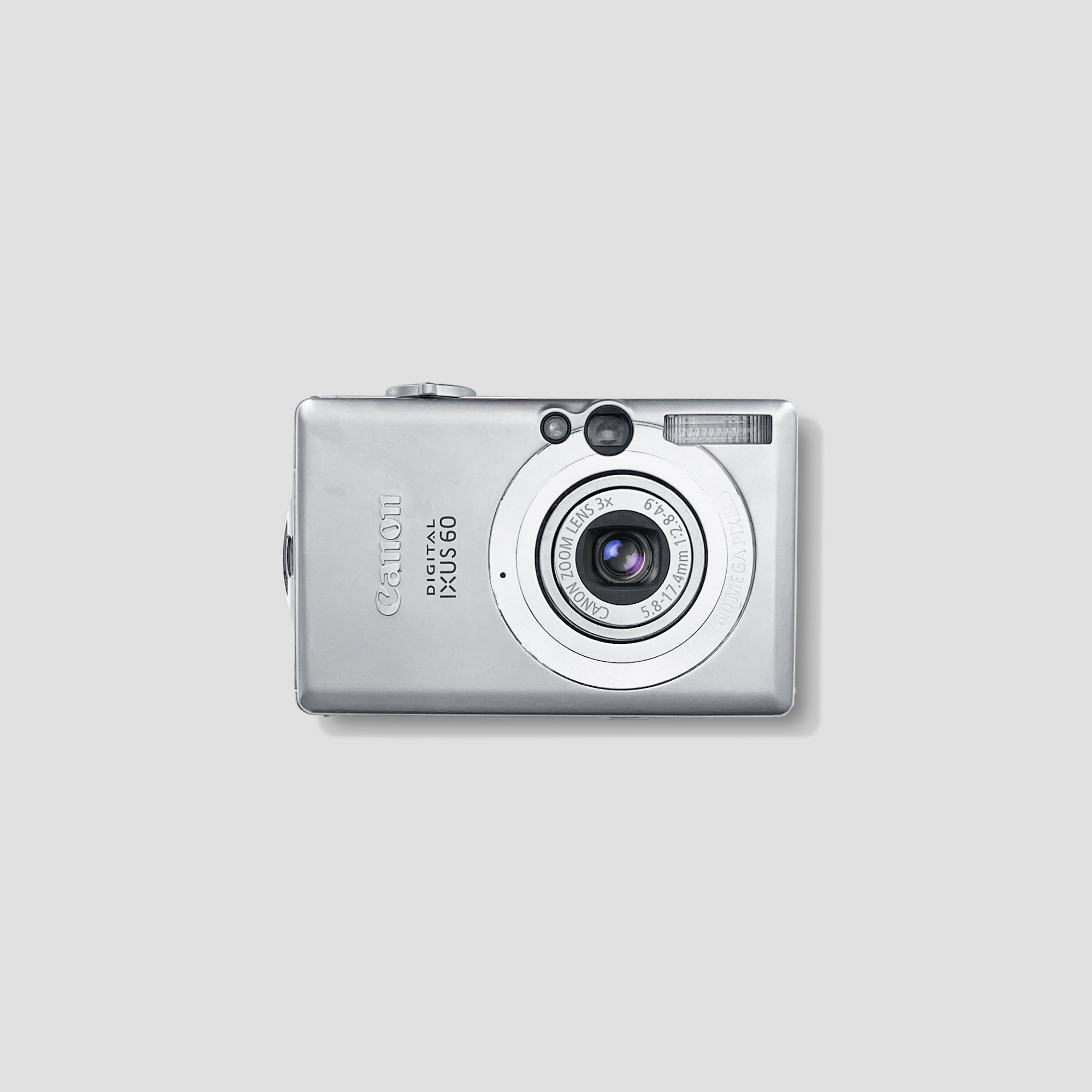 Canon IXUS 60 compact digital camera from the front showing the lens and LCD screen