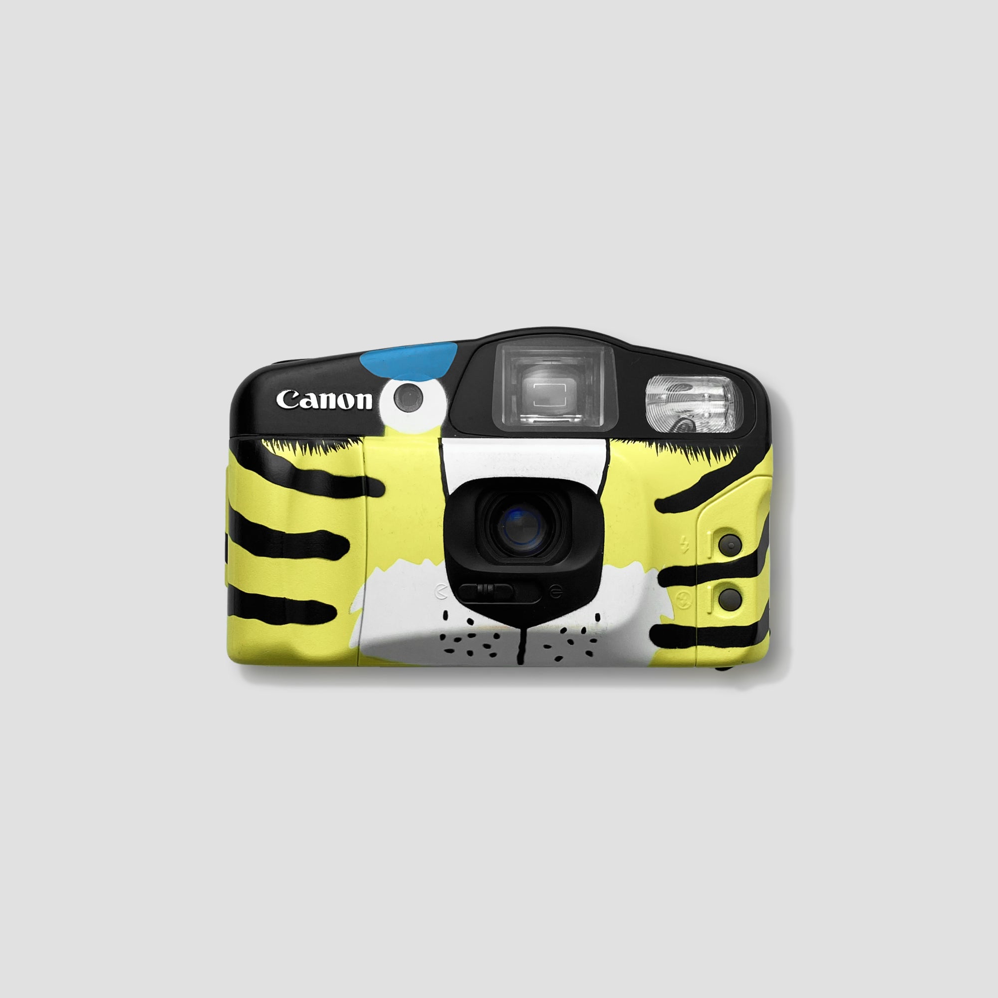 Front view of the limited edition Canon Prima Janosch Tiger Eye camera with tiger stripe pattern