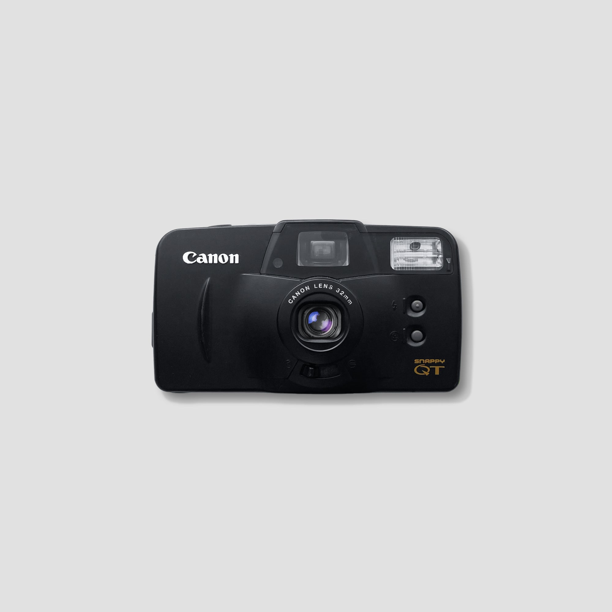 Canon Snappy QT front view showing fixed-focus lens and built-in flash