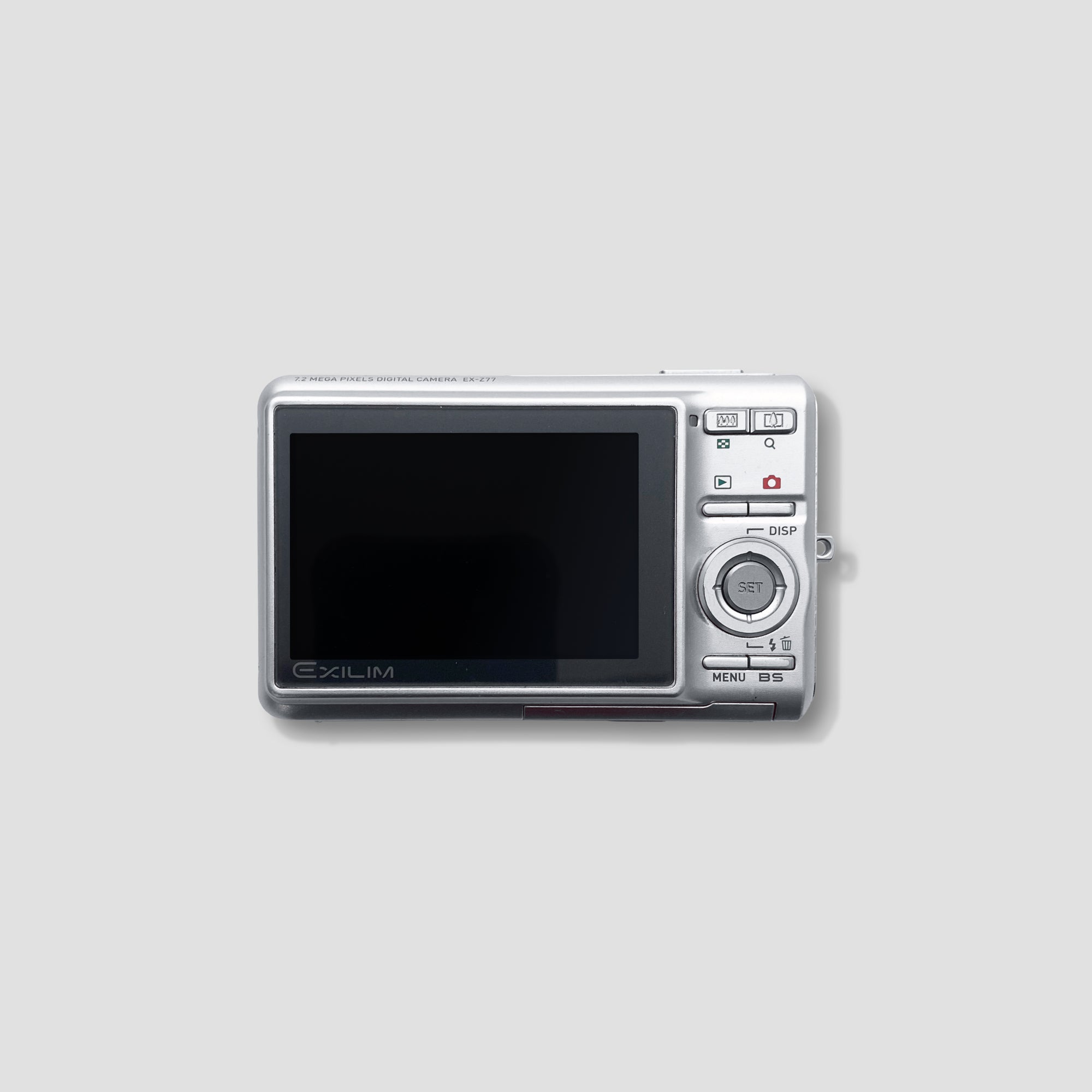 Casio Exilim EX-Z77 being used outdoors, demonstrating its compact size and lightweight build for travel
