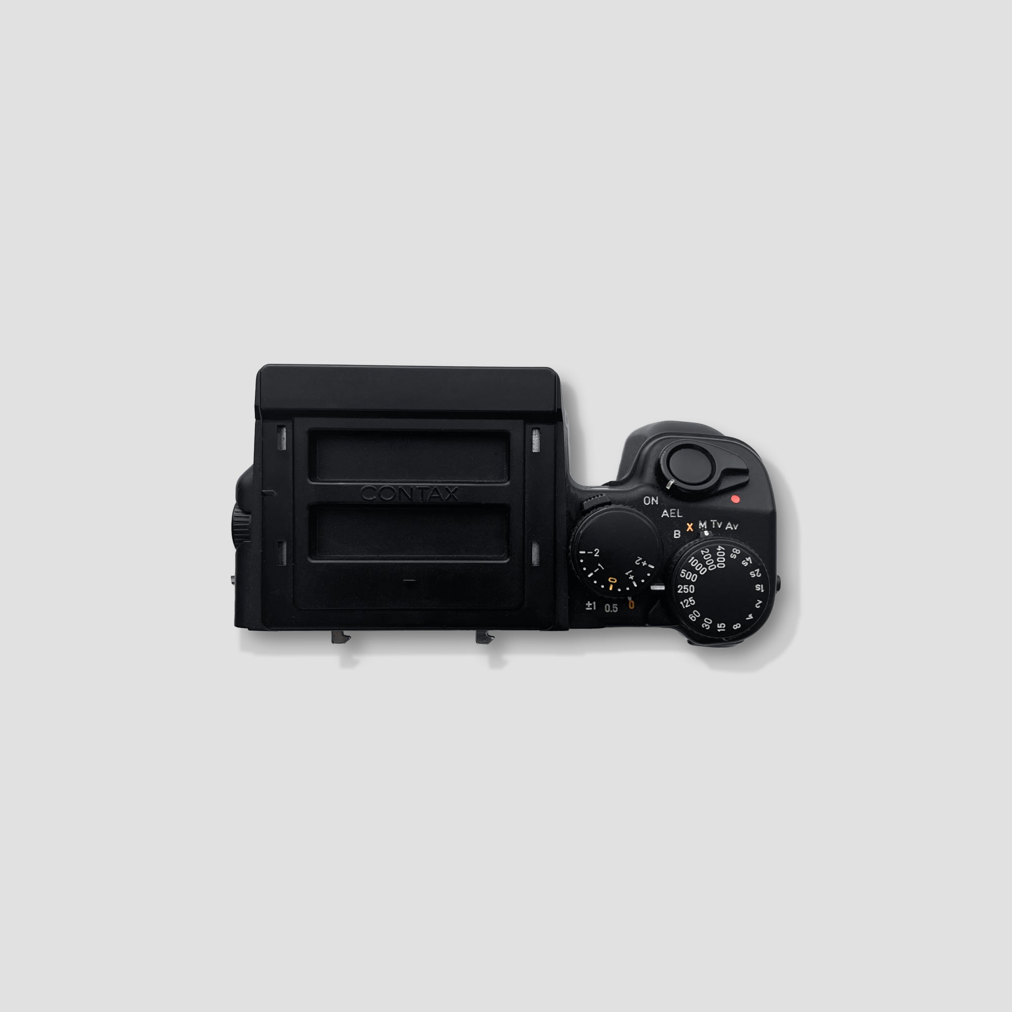 Contax 645 kit components including lenses, film backs, and accessories laid out