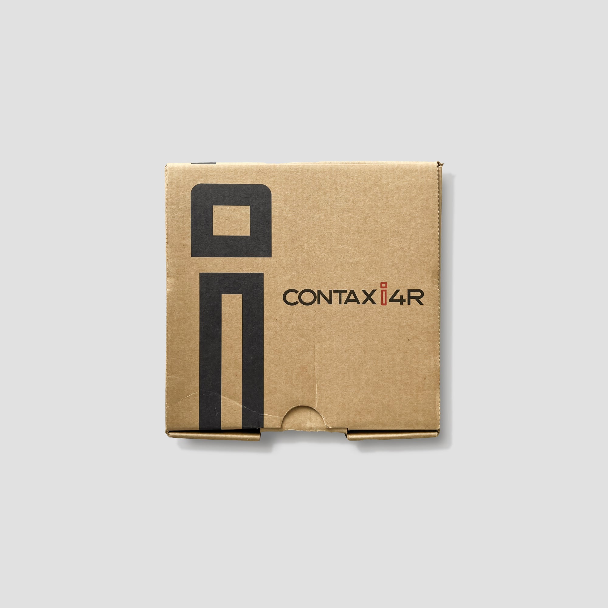 Close-up view of the Kyocera Contax I4R showcasing its stylish design and controls.