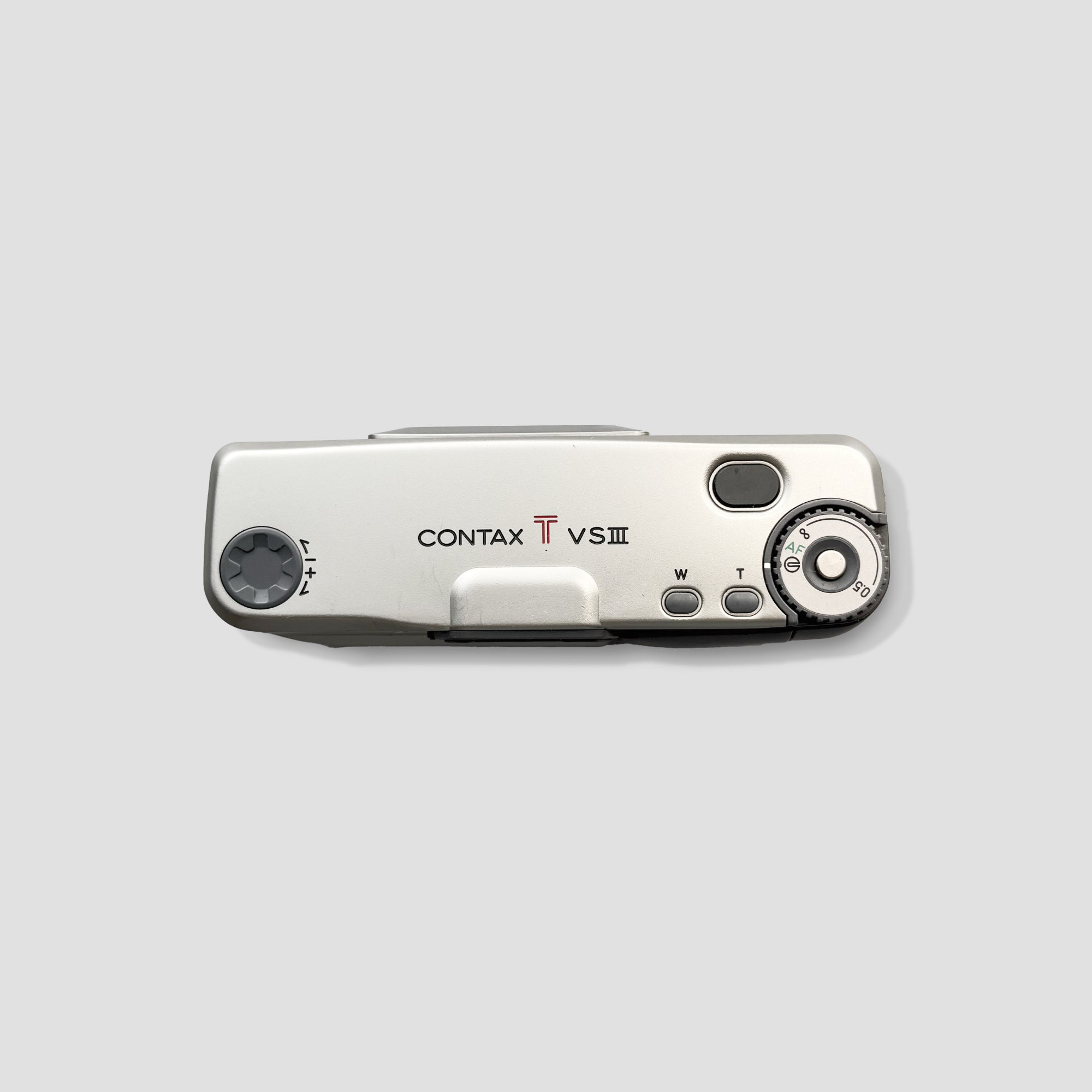 User holding the Contax T VS III camera, showcasing its portable design for travel photography