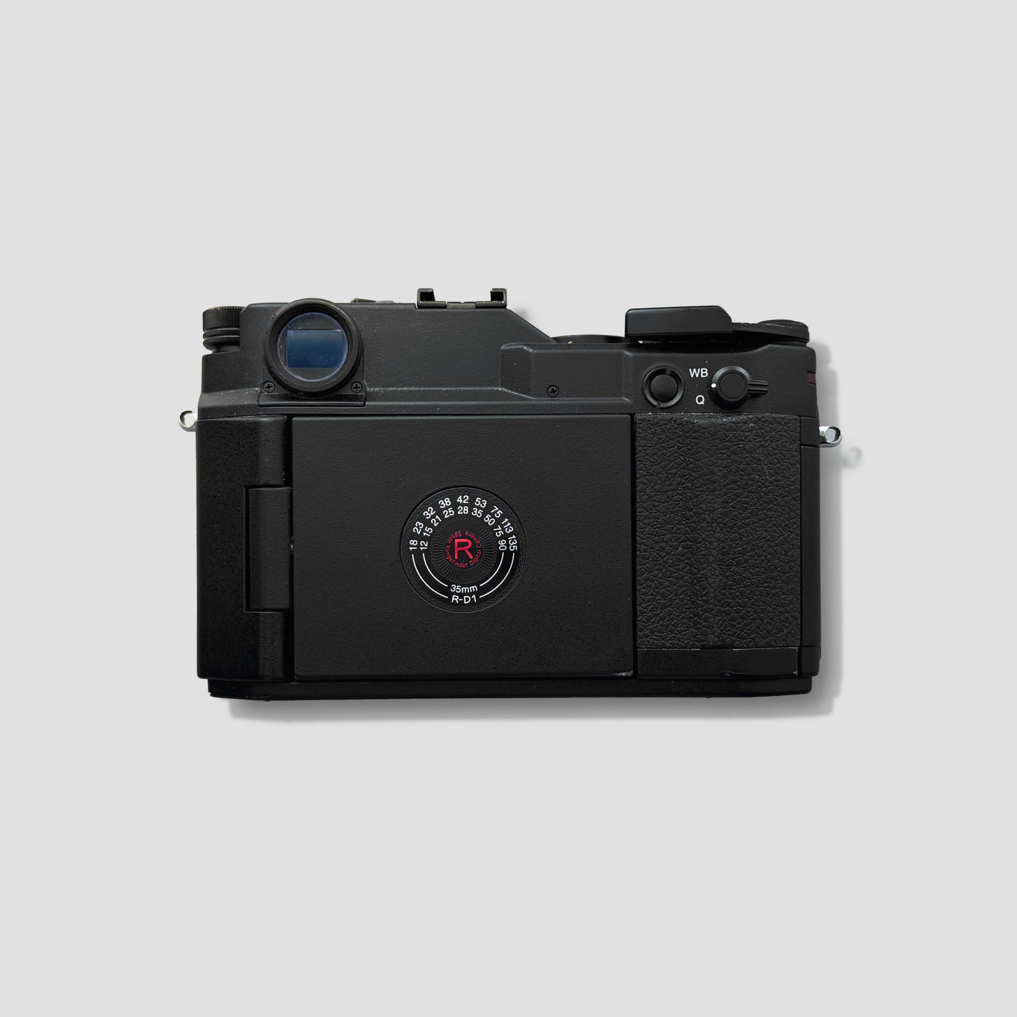 Close-up of the Epson R-D1 showing its mechanical shutter cocking lever and controls.