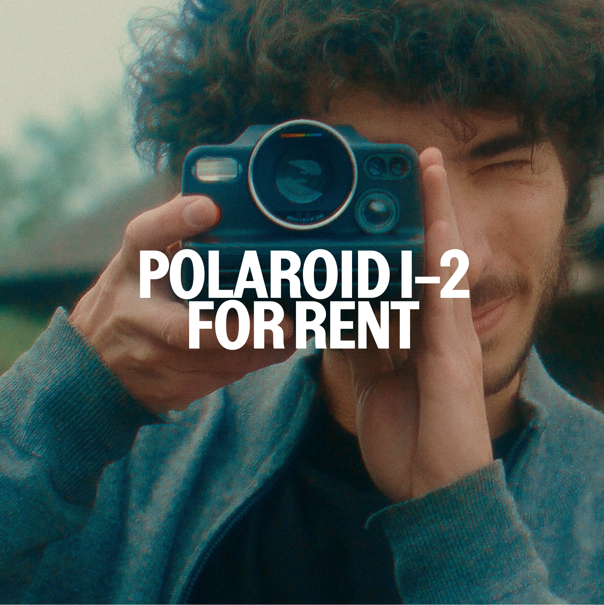 Front view of the Polaroid I-2 instant camera showing manual controls and display