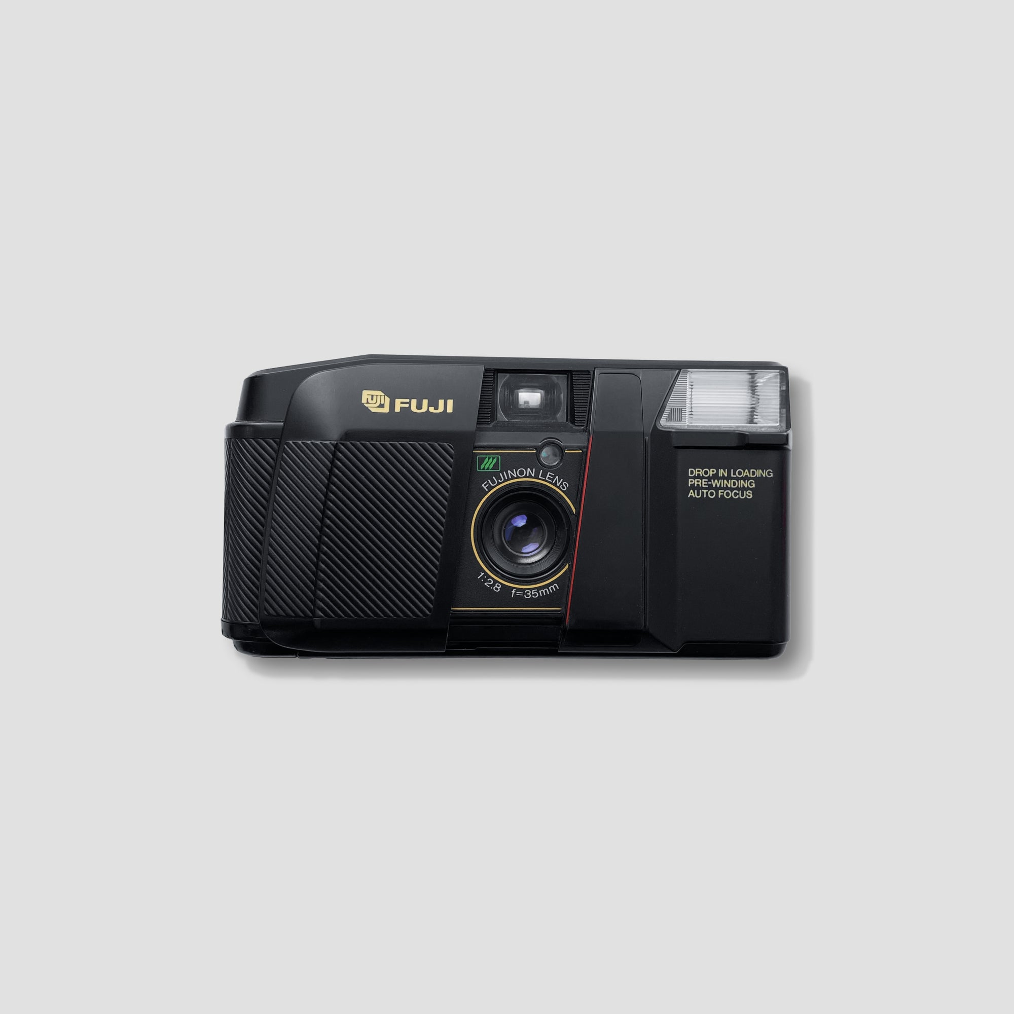 Fuji DL-300 point and shoot film camera showcasing its compact design and flash feature.