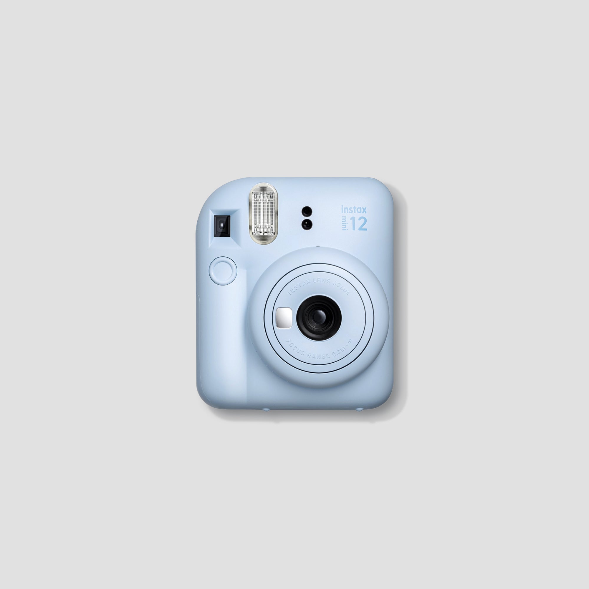 Fujifilm Instax Mini 12 Instant Camera in action, showcasing its selfie mirror feature.