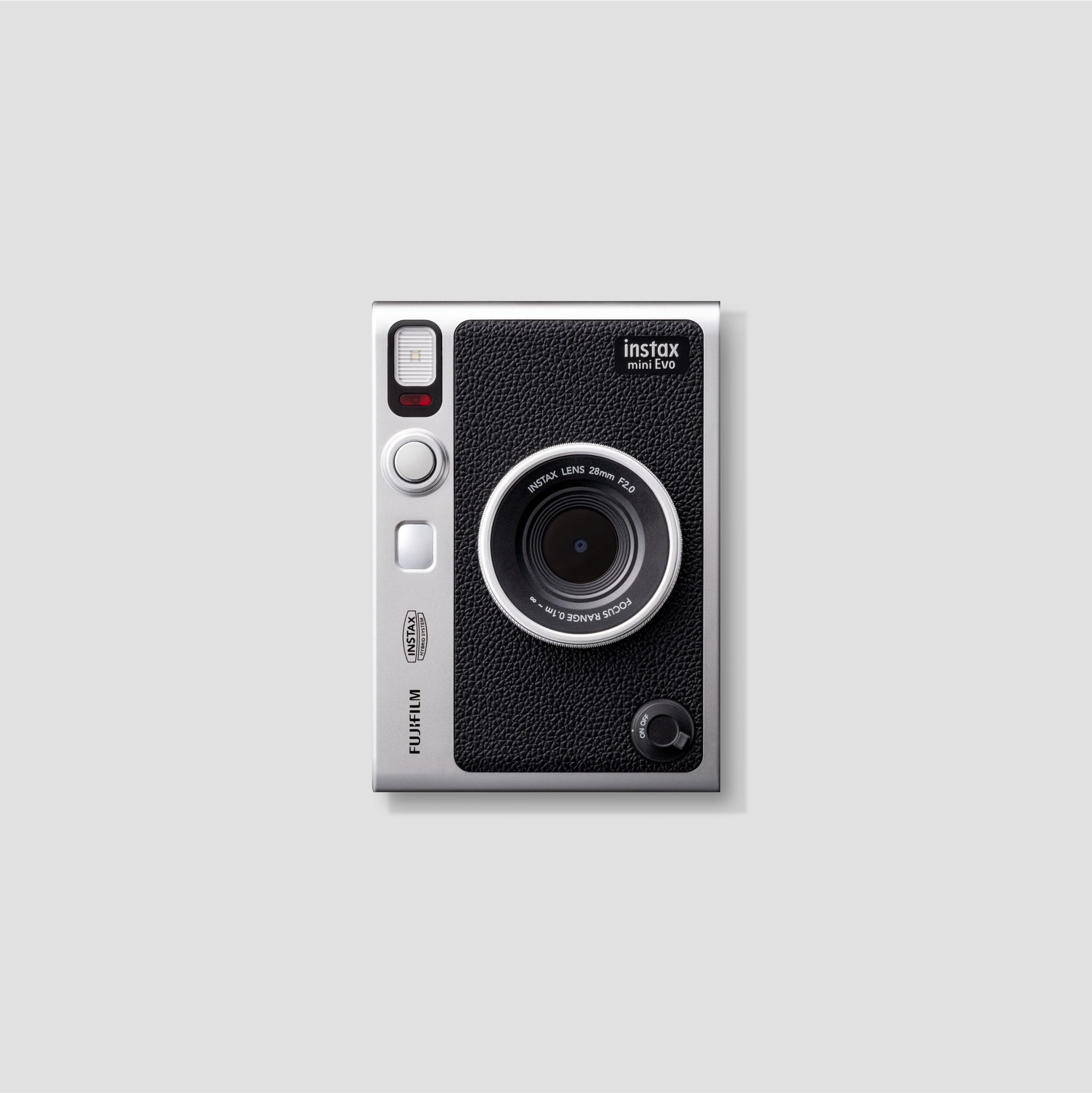Fujifilm Instax Mini Evo captured from the front, showcasing its sleek design and hybrid features.