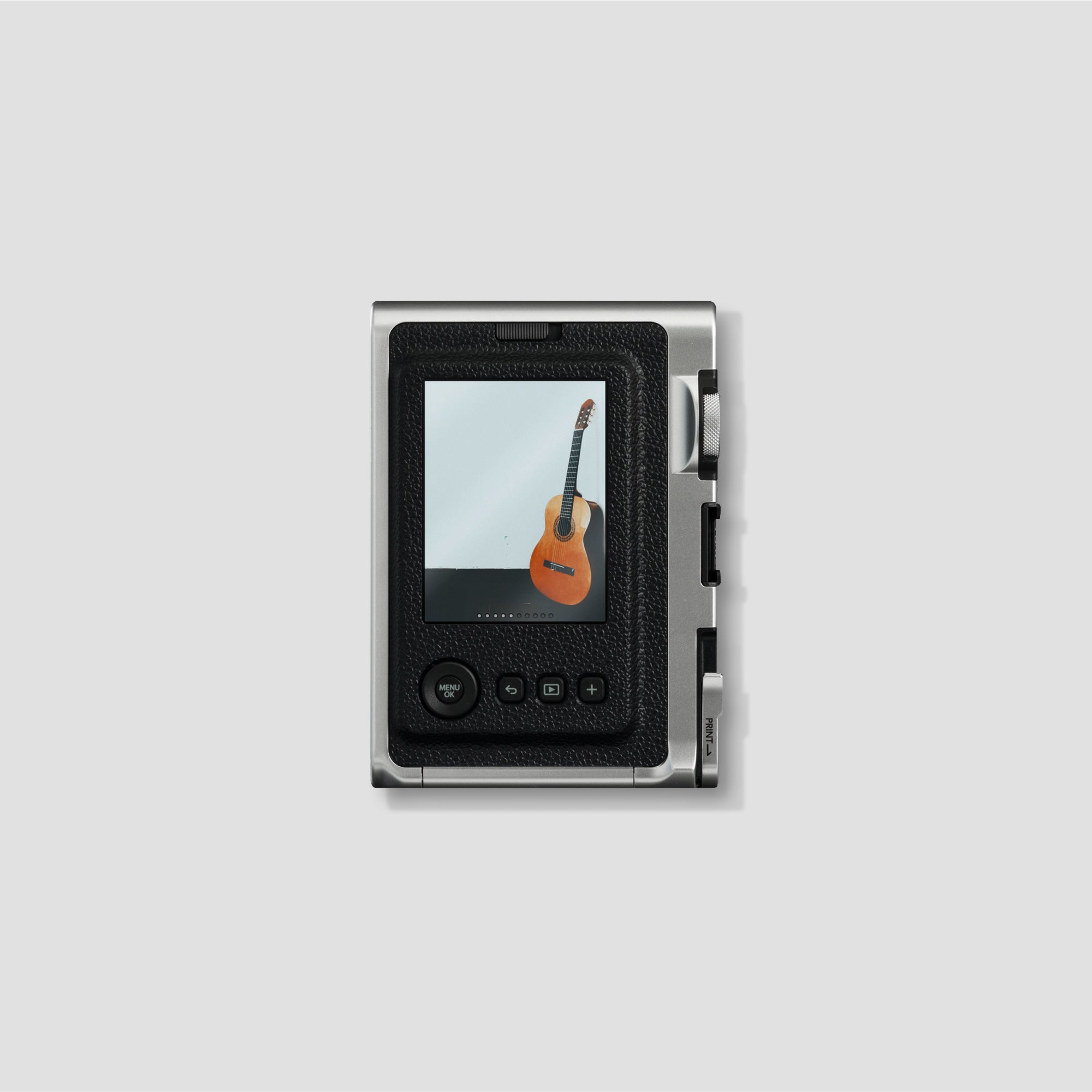 Close-up of the Fujifilm Instax Mini Evo displaying the various lens modes and film filters available.