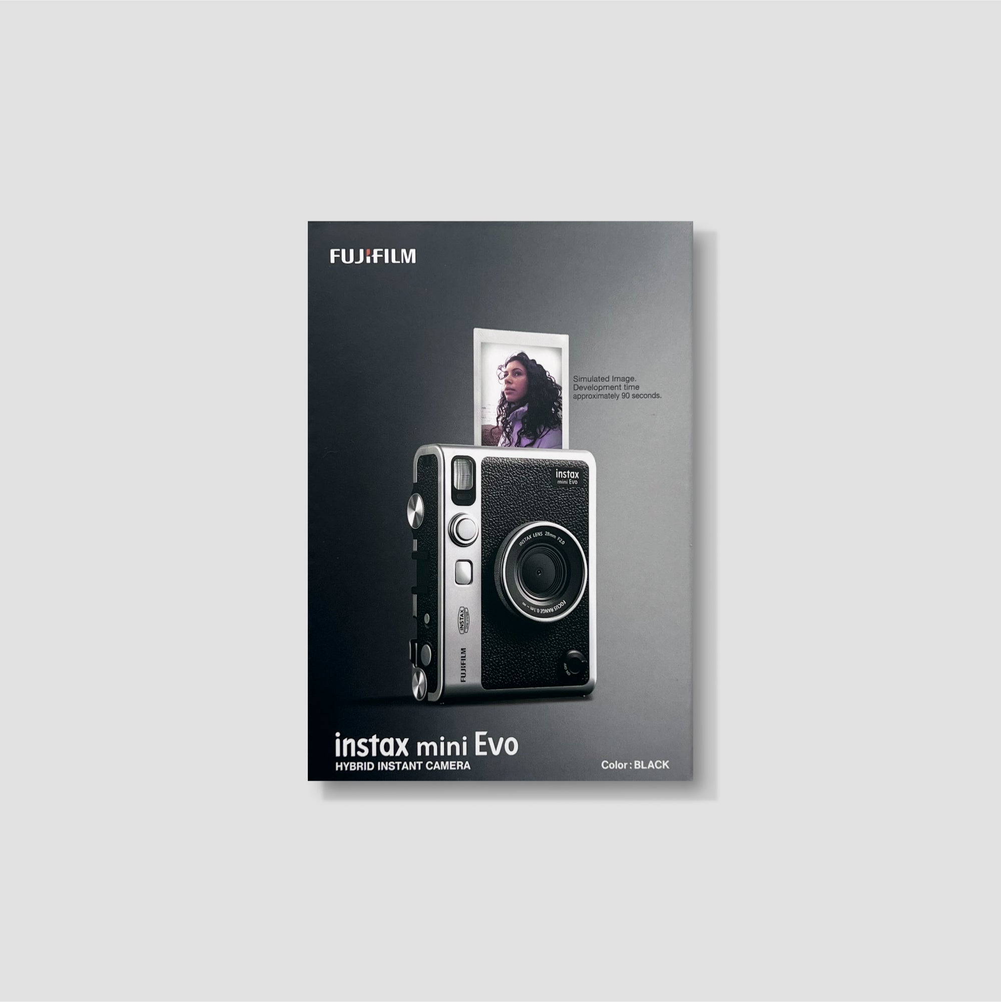 User  taking a photo with the Fujifilm Instax Mini Evo, highlighting its instant printing capability.