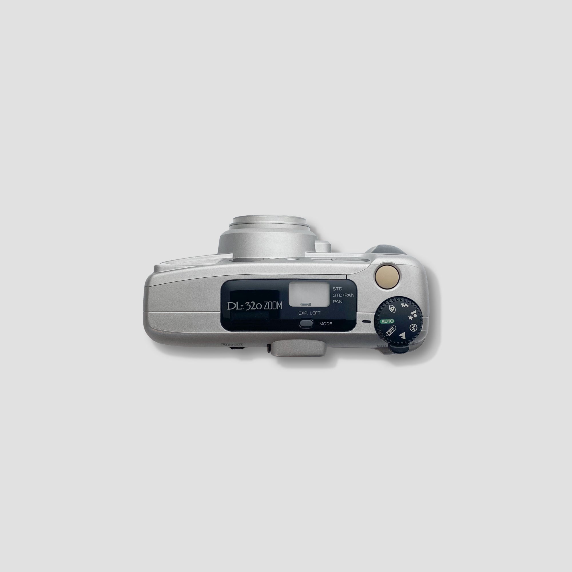 Side angle of the Fujifilm DL-320 Zoom highlighting its compact design and remote control feature.