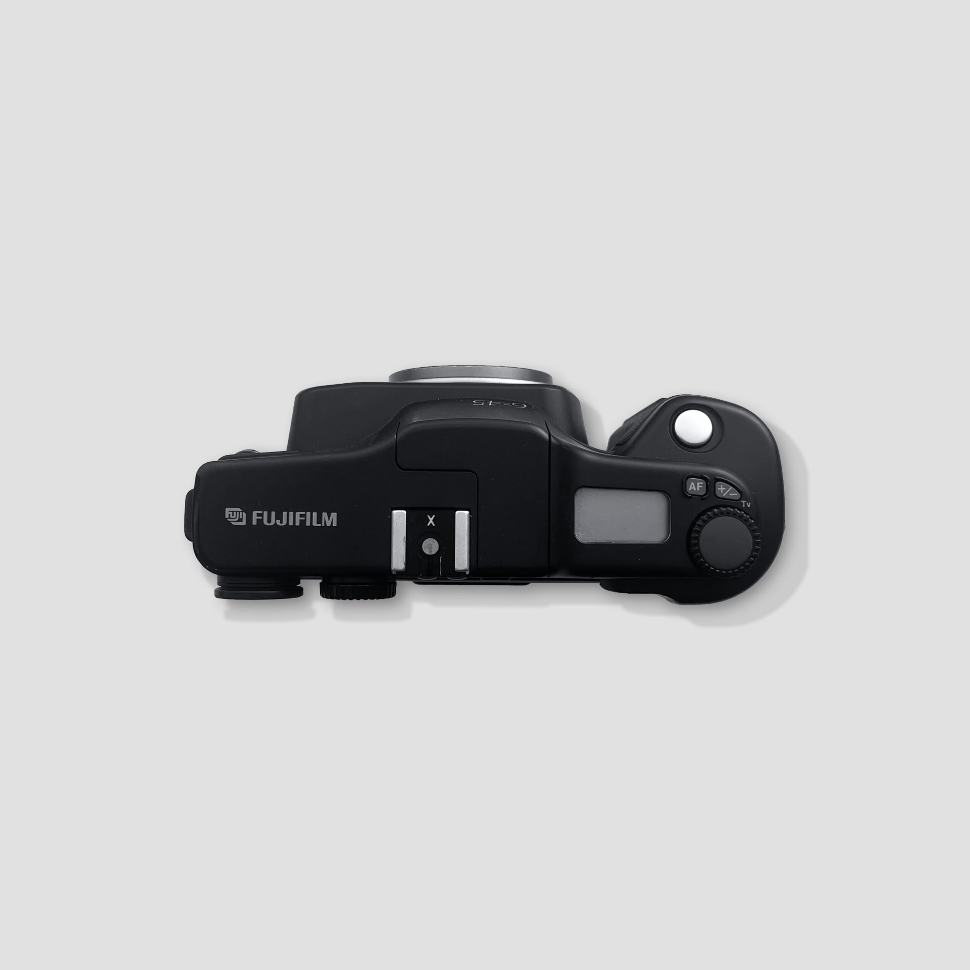 Close-up of the Fujinon 60mm f/4 lens on the Fujifilm GA645, ideal for capturing stunning portraits.