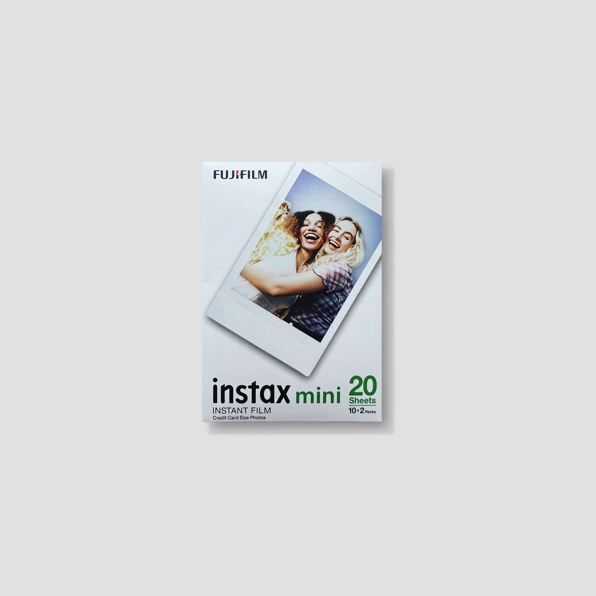 Flat lay of Instax Mini film pack with two cartridges for polaroid camera use