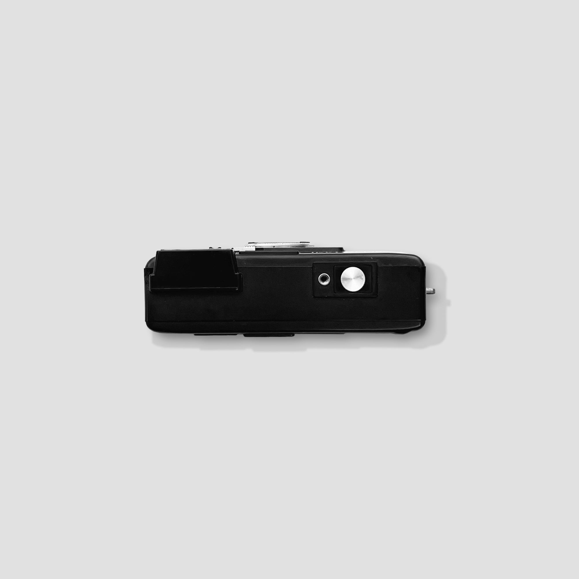 Vintage 1980s film point-and-shoot camera in hand, ideal for travel and everyday use