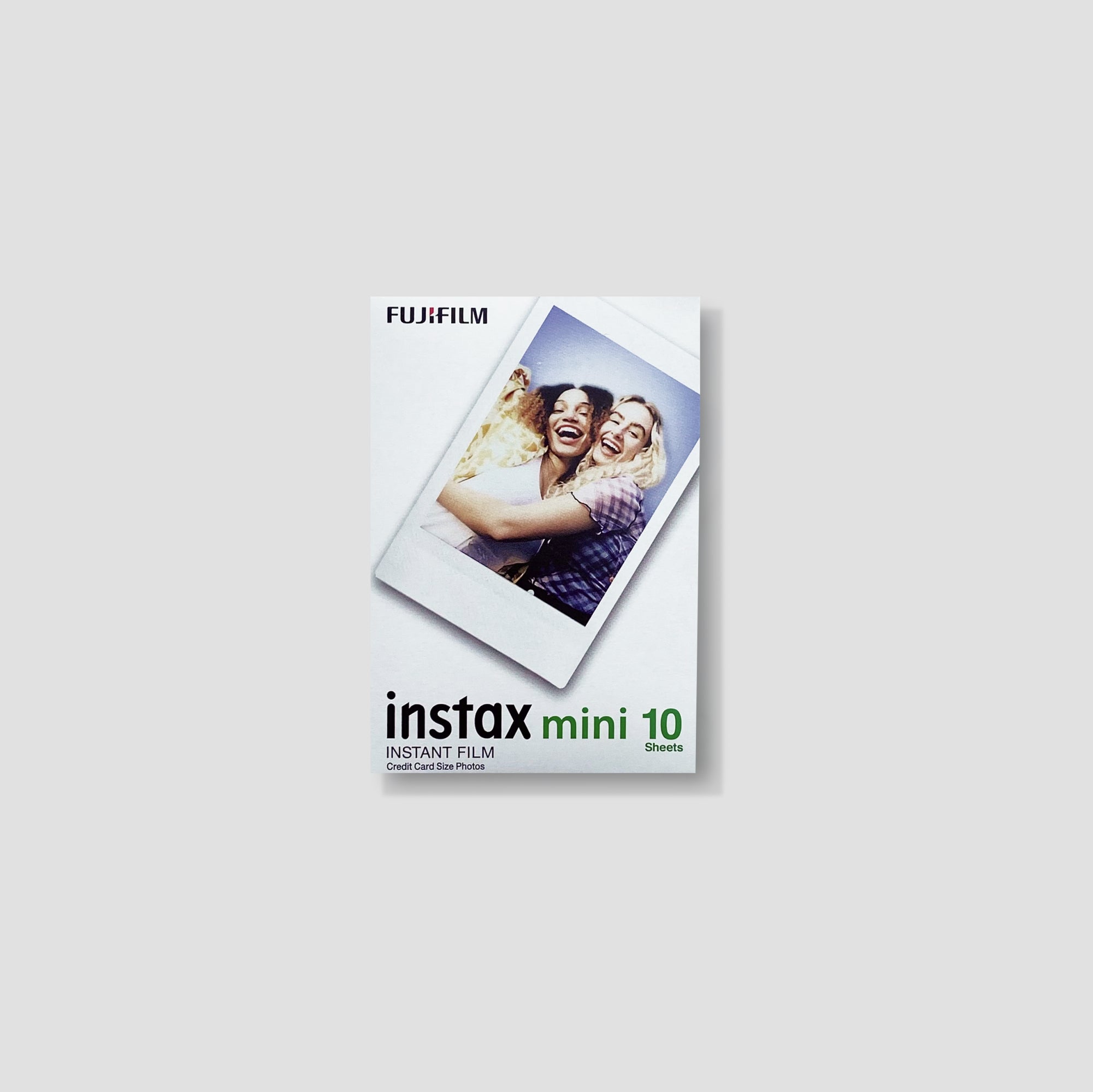 Flat lay of Instax Mini film pack with two cartridges for polaroid camera use