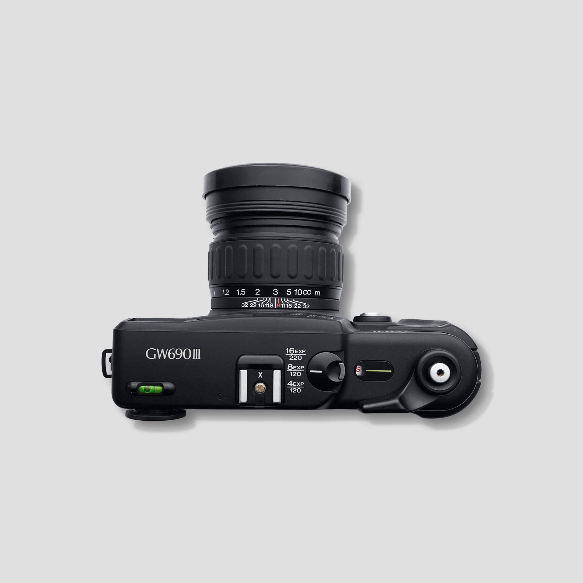 Side profile of medium format camera on tripod outdoors—ideal setup for landscape photography.