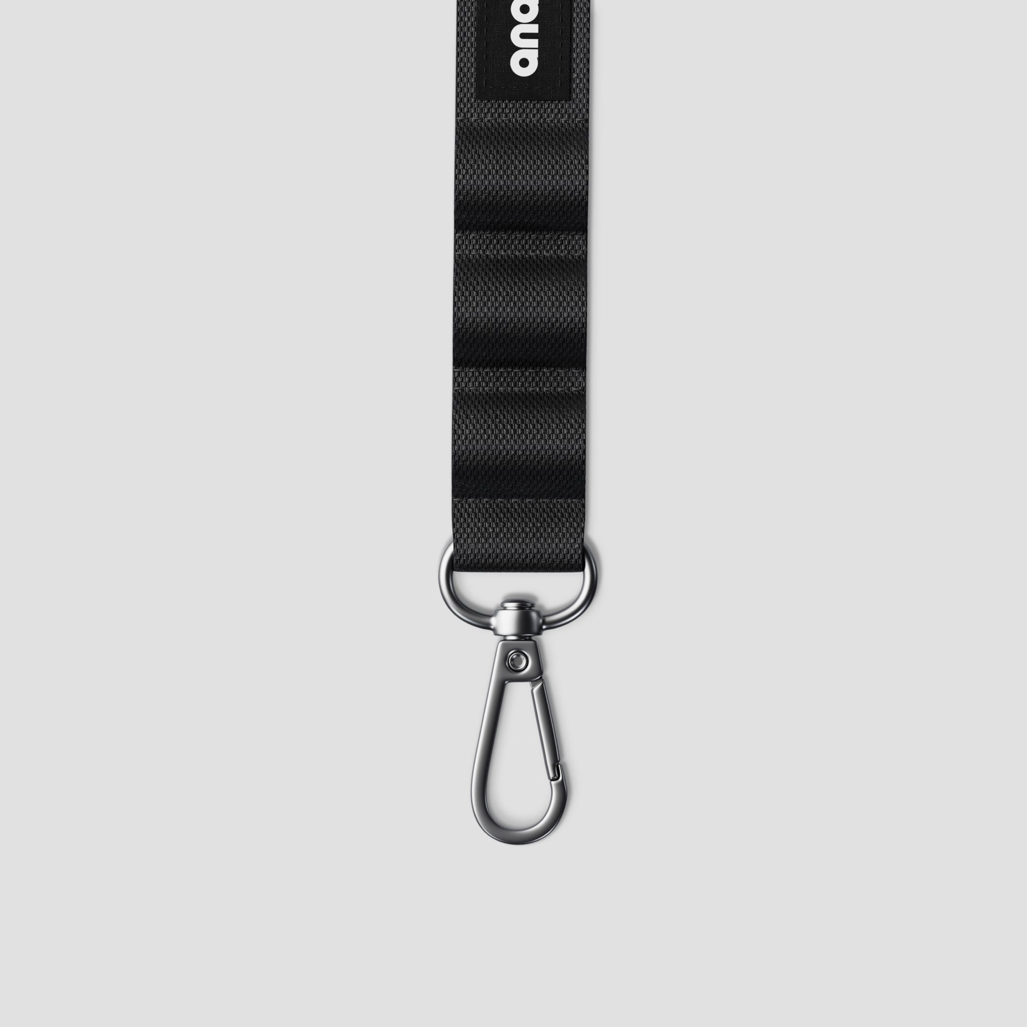 Professional photographer using Elevate Grey Mini Camera Sling in an outdoor setting