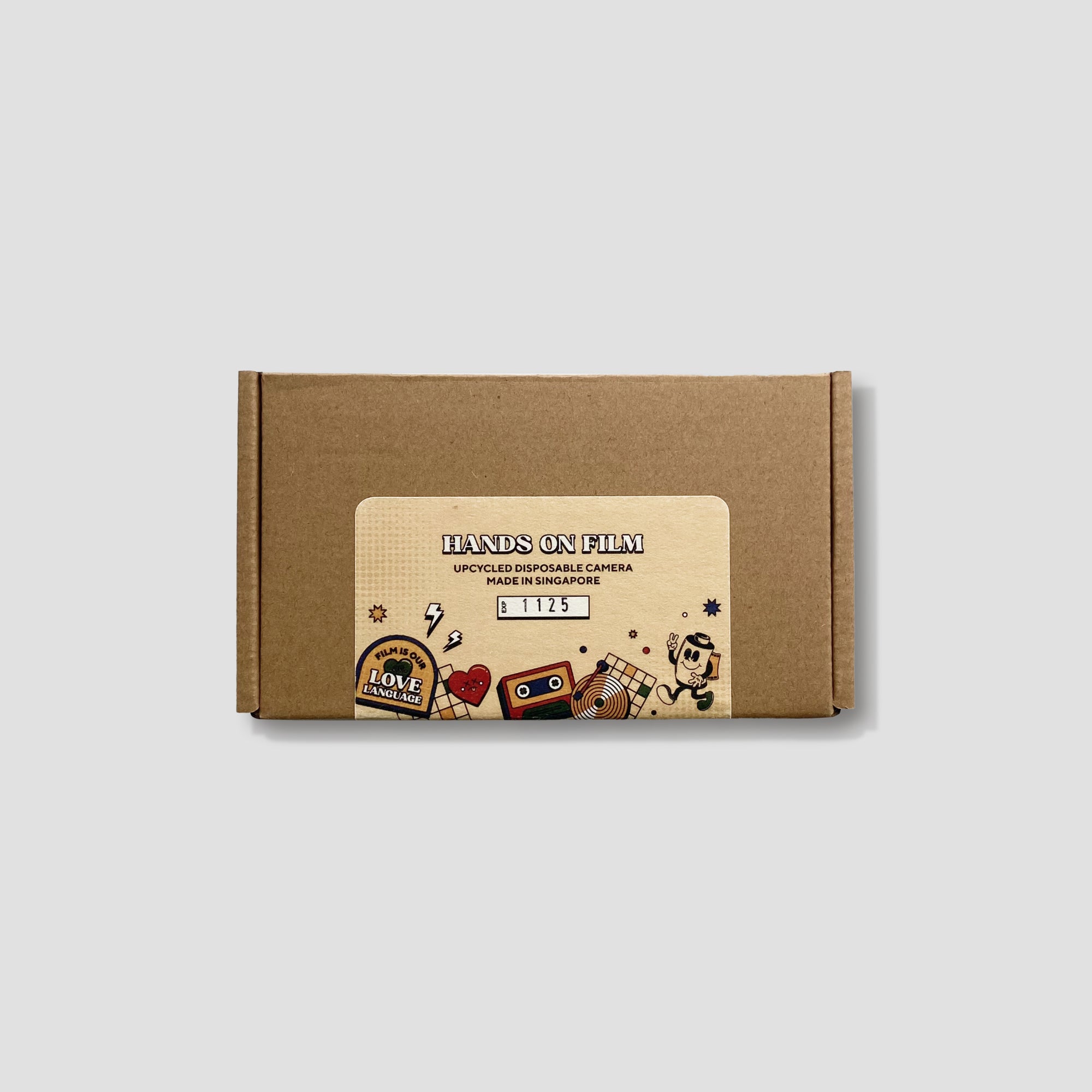 RetroSnap camera with included pouch, stickers, and manual laid out for beginners