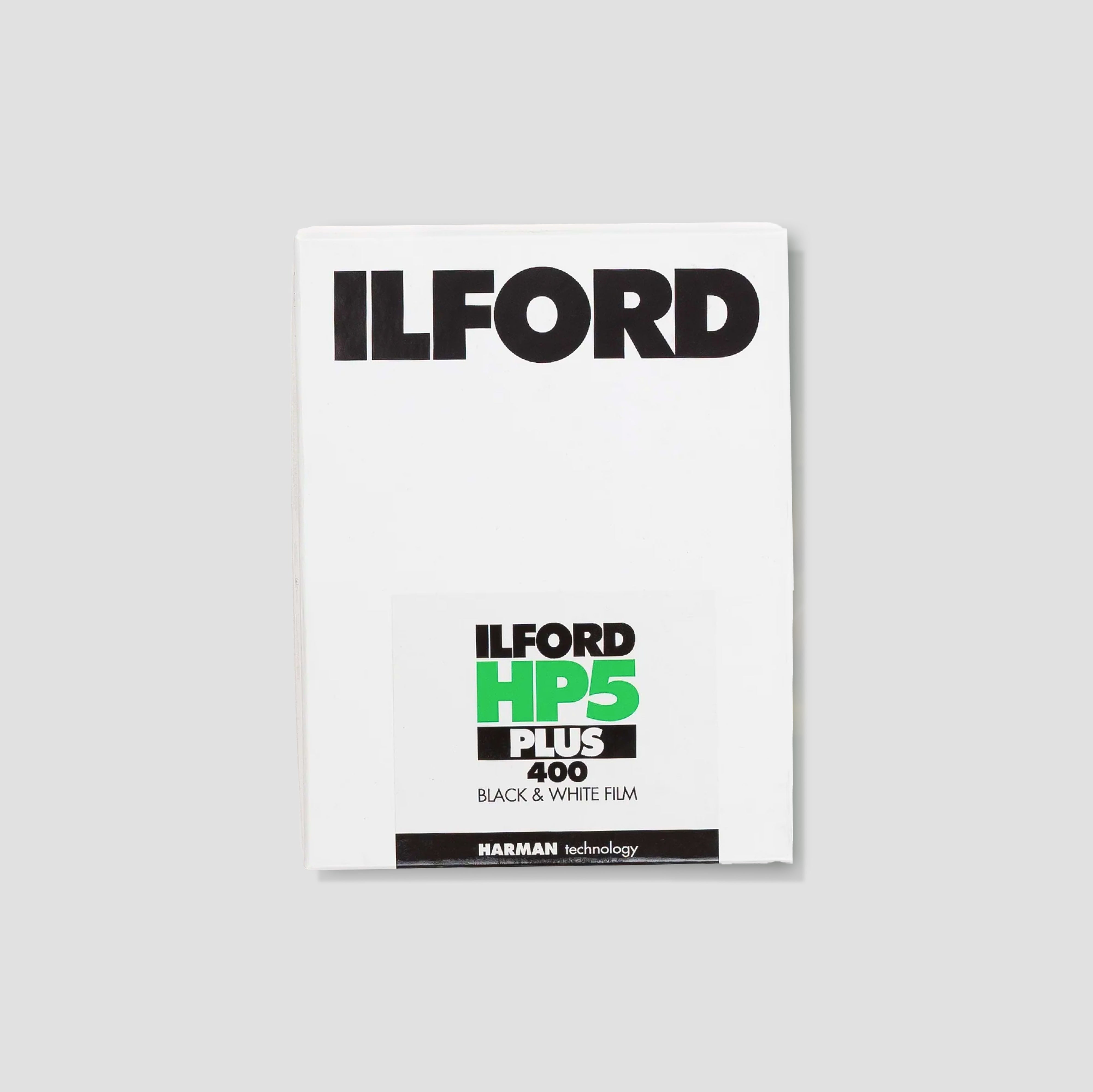 Close-up of ILFORD large format film sheets in different sizes, ready for professional photography.