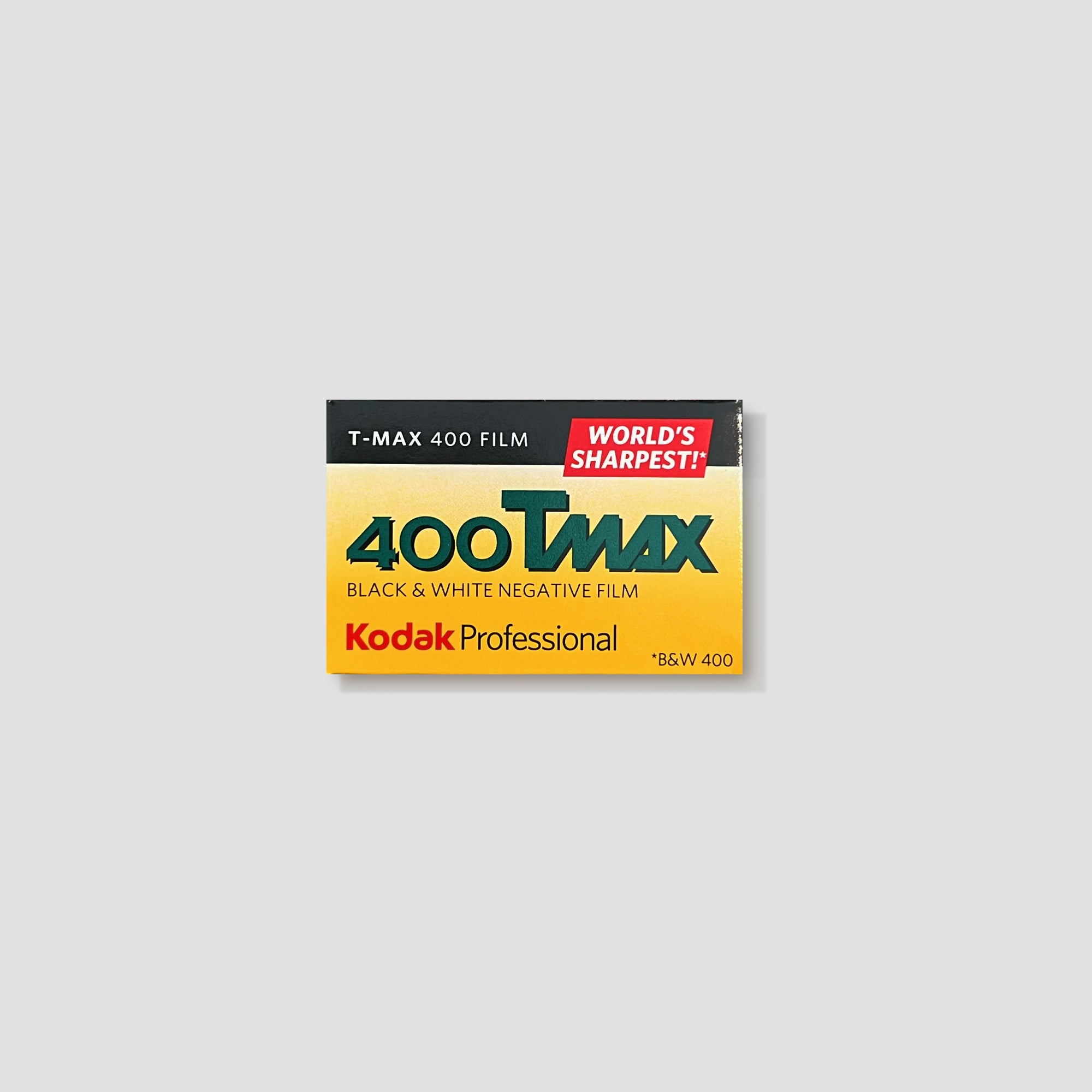 Kodak T-Max 400 black and white film roll on a photography table