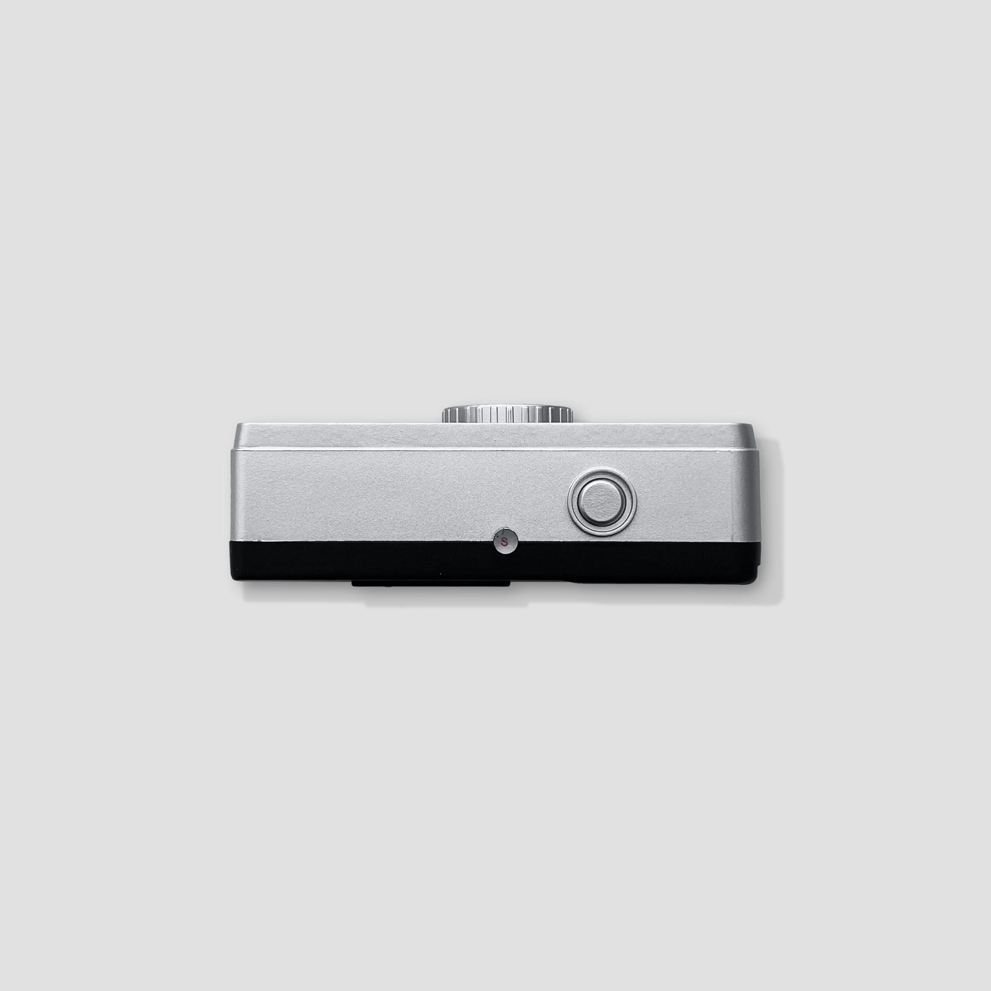 Close-up of Kodak Ektar H35 film camera revealing its manual film advance and rewind features.