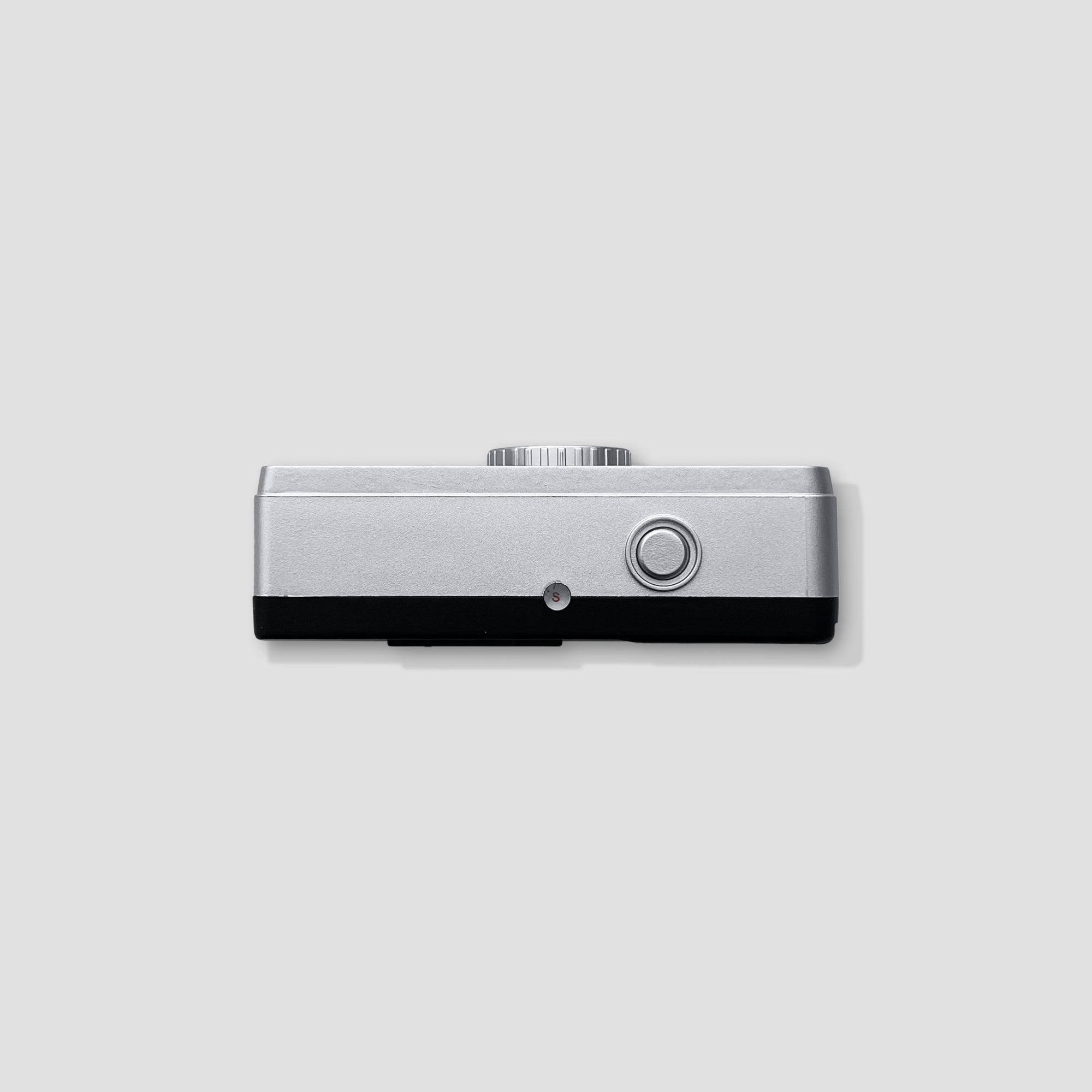 Close-up of the cameras lens and manual film advance feature