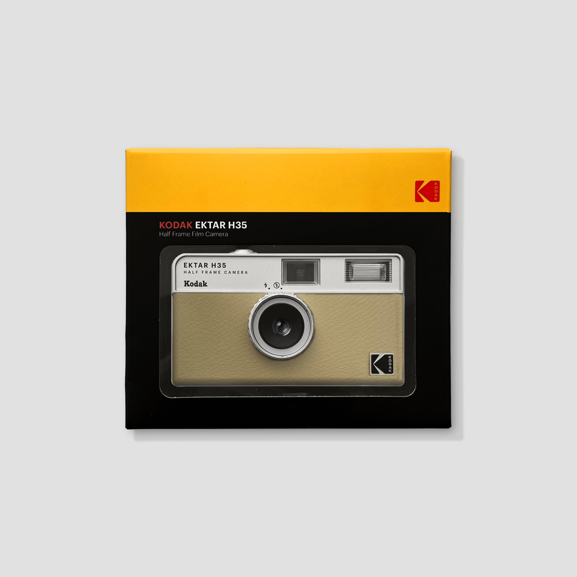 Front view of Kodak Ektar H35 Sand compact 35mm film camera in hand