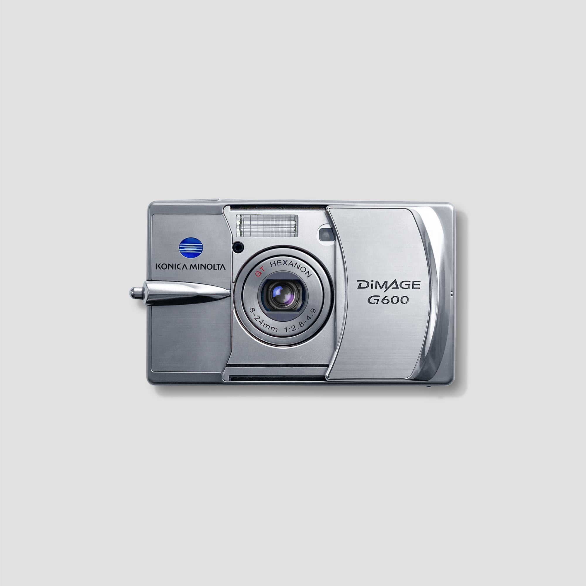 Travel-ready point and shoot digital camera in hand