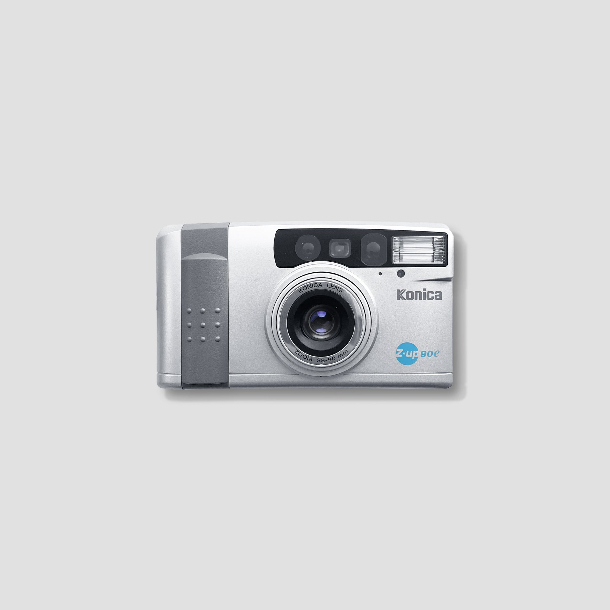 Side view of the Konica Z-up 90e showcasing its compact design and zoom lens.