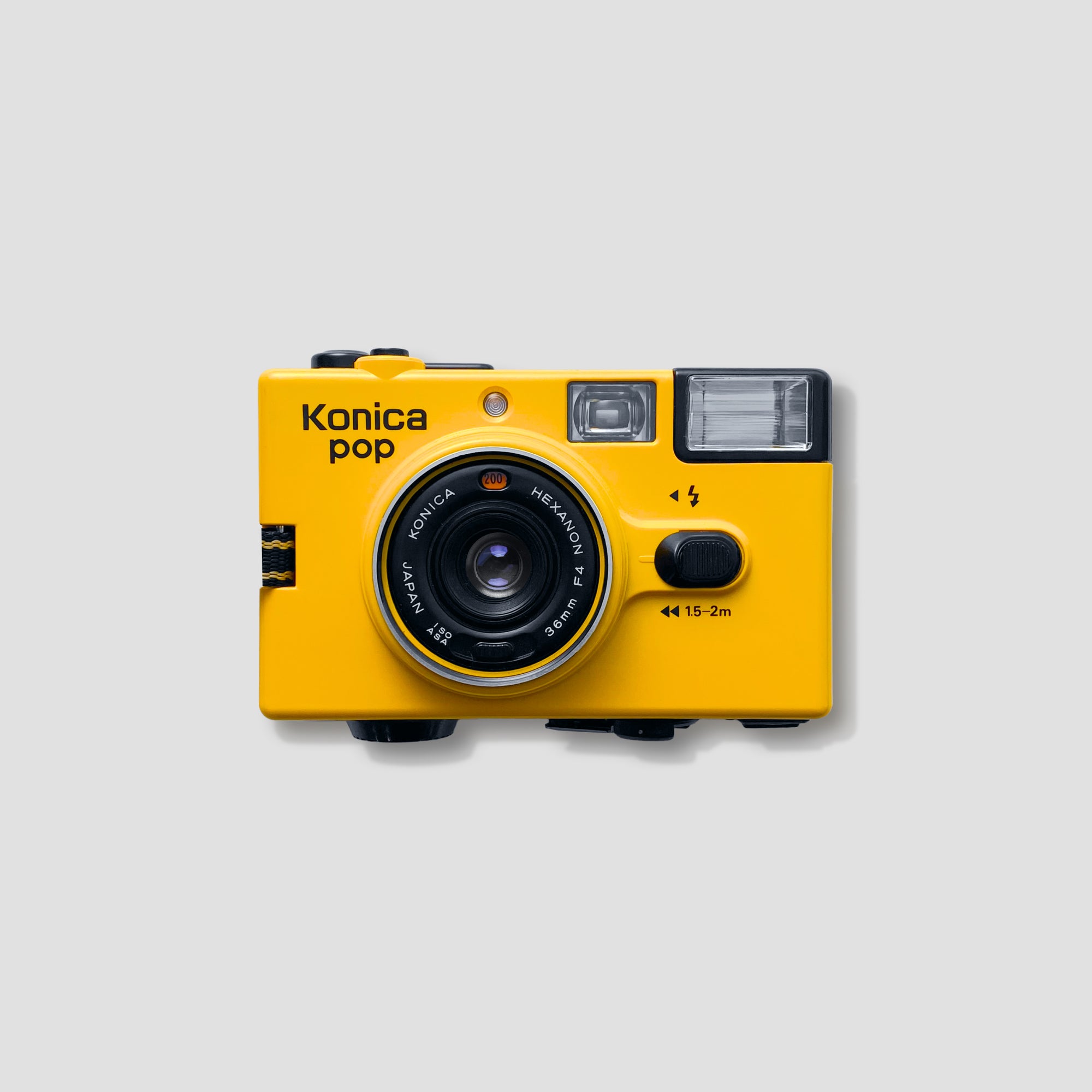 Close-up of the Konica Pop Yellow showing its vibrant design and compact size.