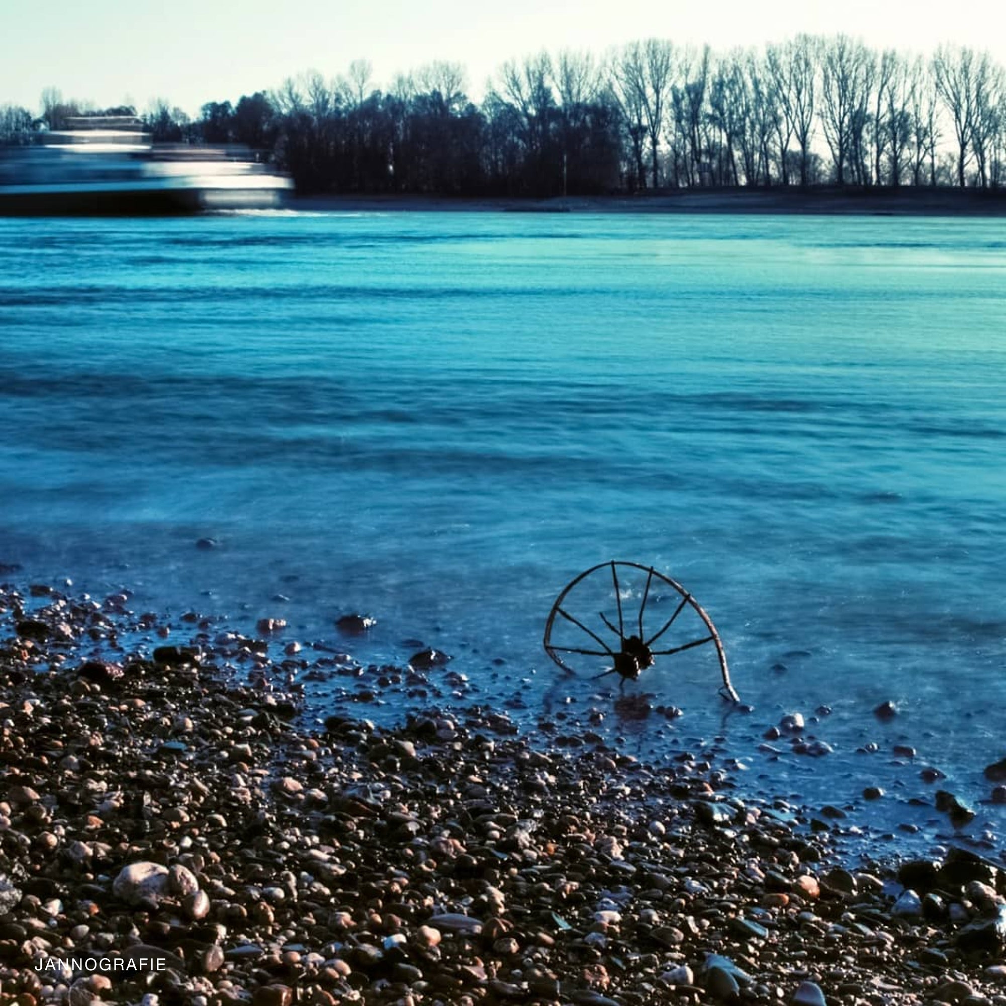 Kono! Donau II film roll against a picturesque sunset, highlighting its blue and purple tones for stunning landscapes.