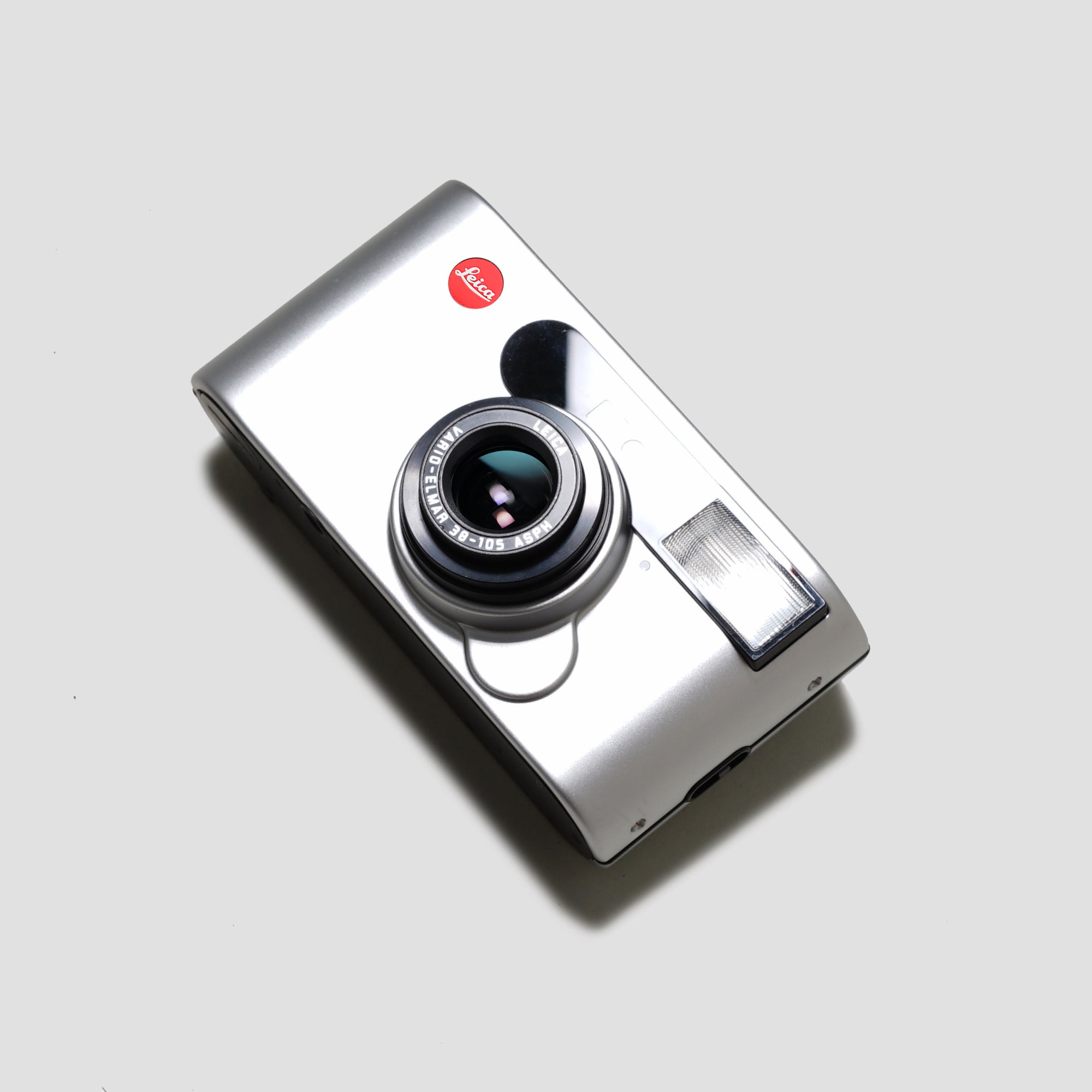 Leica C1 compact camera in hand, highlighting its ergonomic grip and lightweight feel