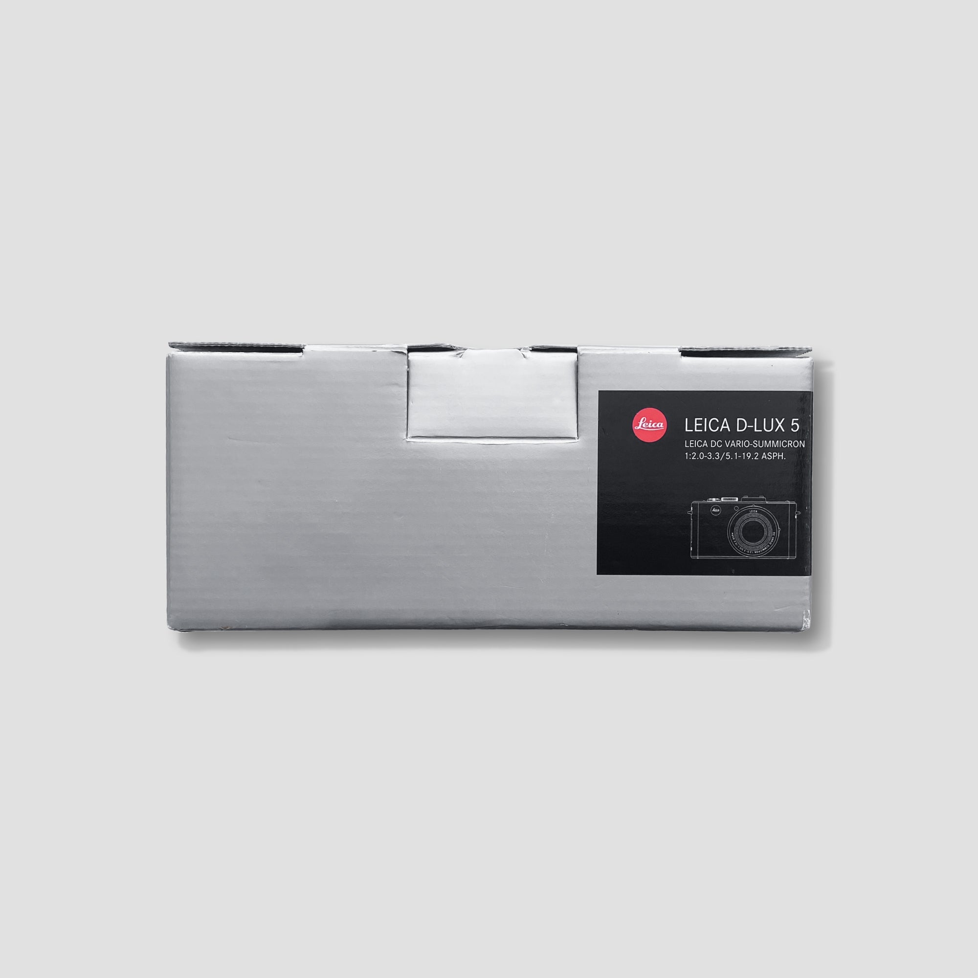 Close-up of the Leica D-Lux 5 lens highlighting its fast f/2.0-3.3 aperture for stunning low-light shots.