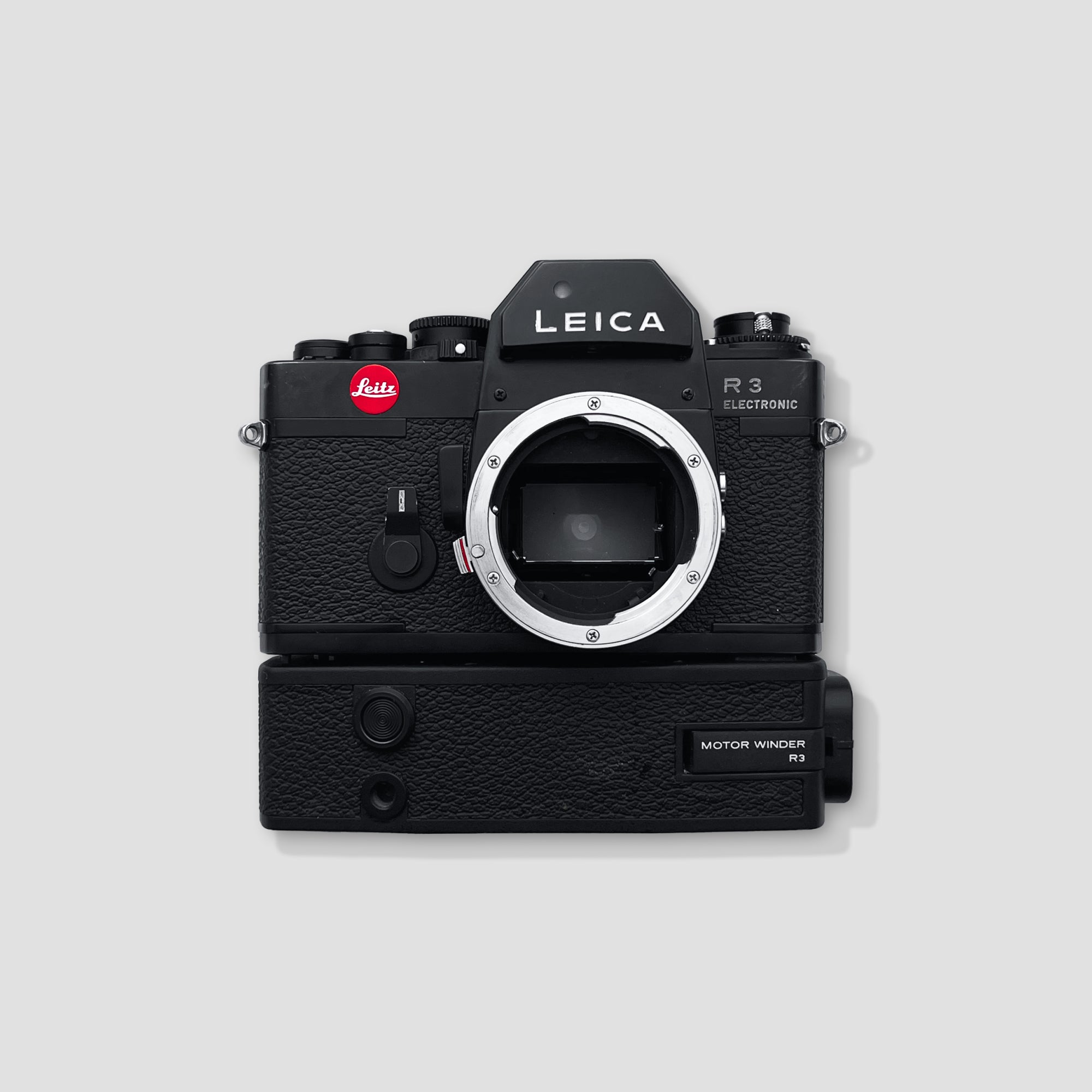 Leica R3 Electronic camera from the front angle, showcasing its sleek design and vintage appeal.