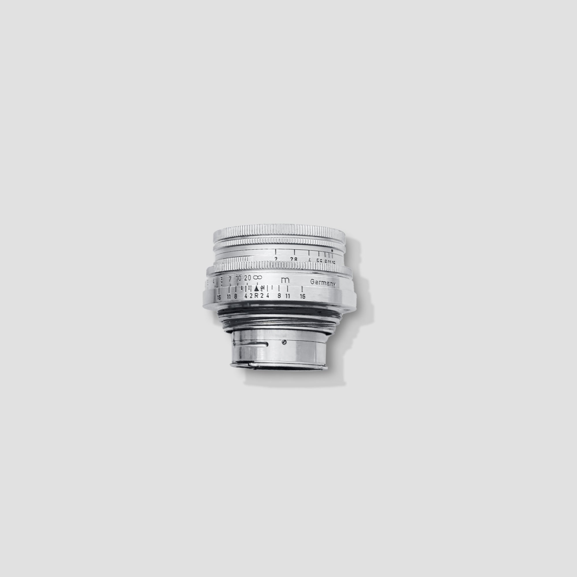 Leica M2 vintage rangefinder camera from the front angle highlighting its sleek body