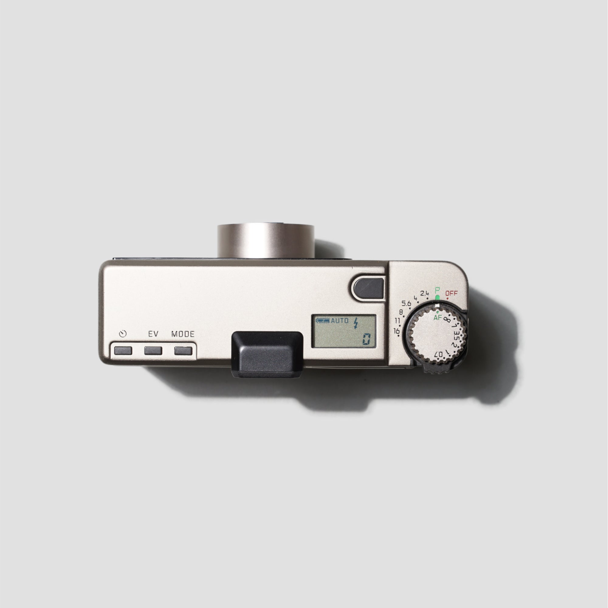 Close-up of Leica Minilux camera in hand during outdoor shoot