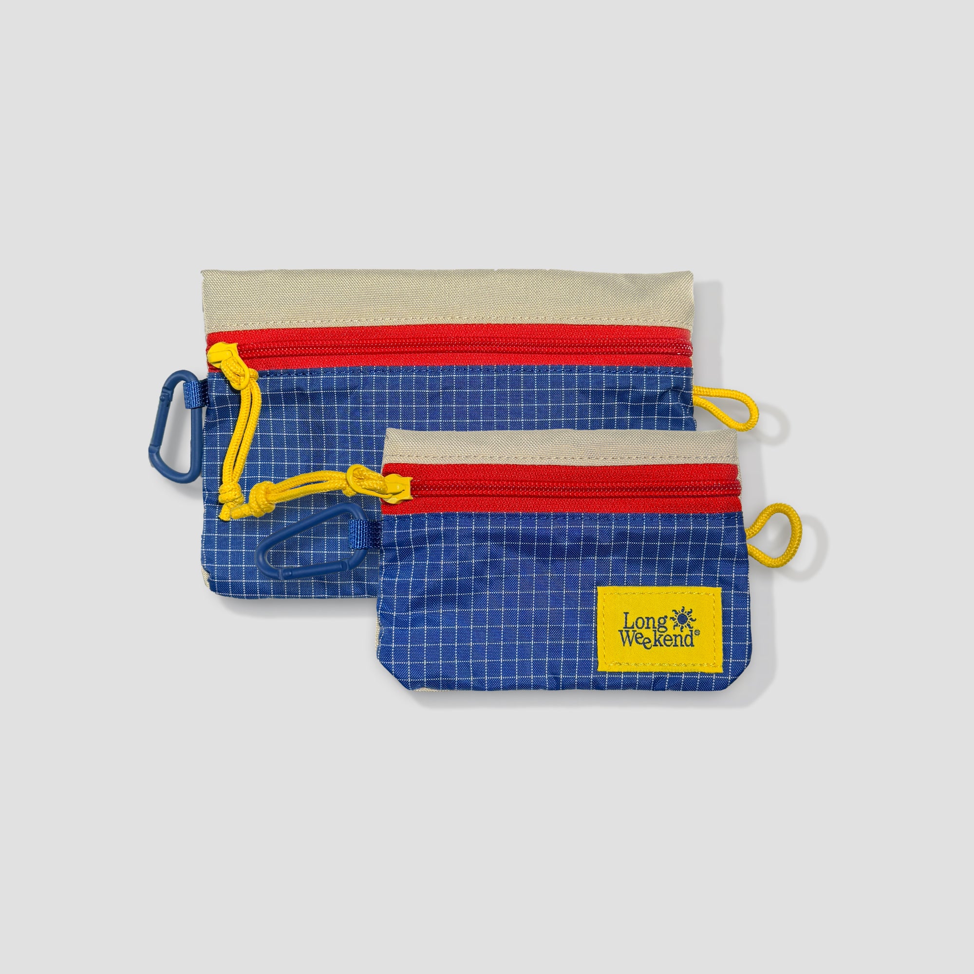 Compact photo pouch with carabiner attached to a backpack
