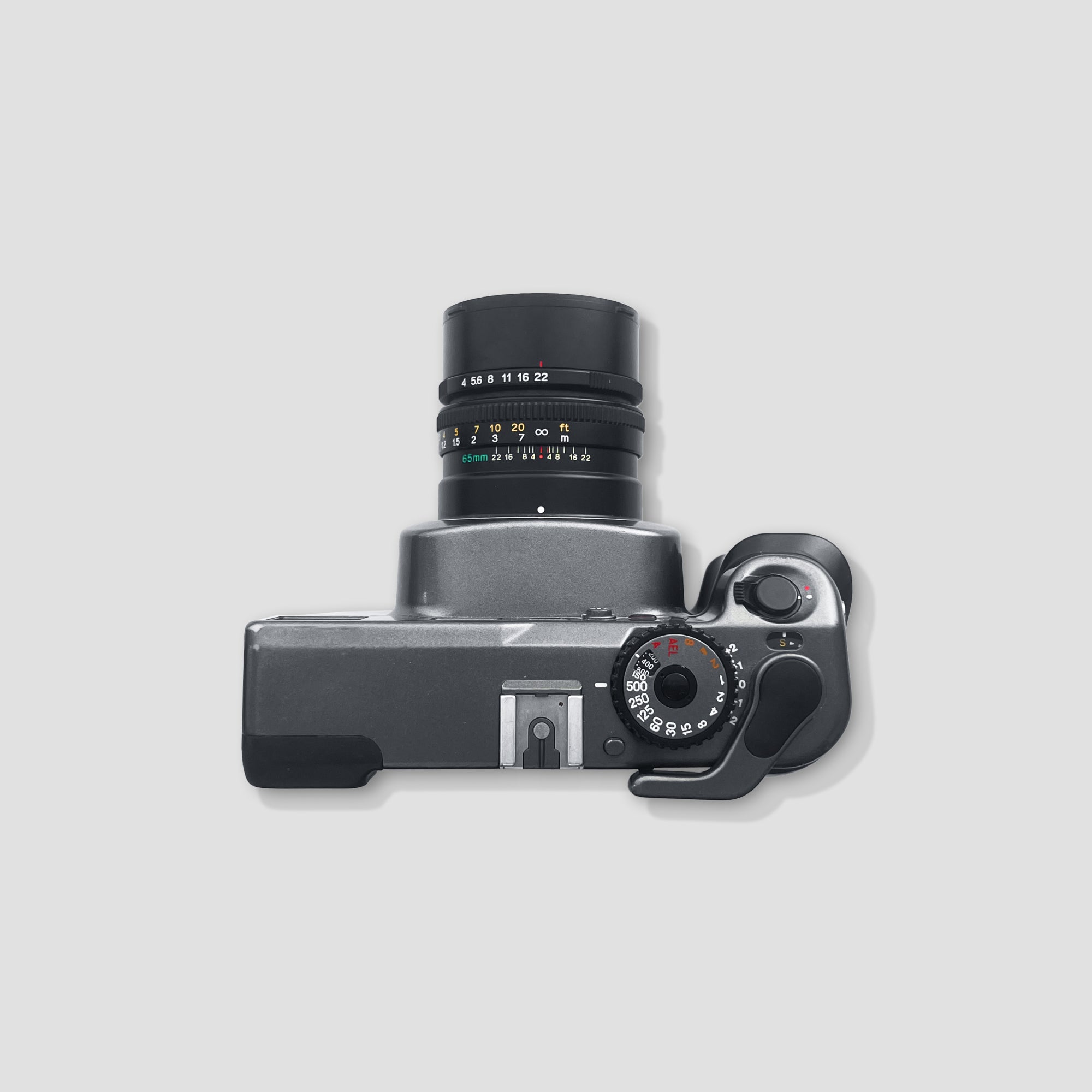 Detailed view of the Mamiya 7s lens and controls for film photography