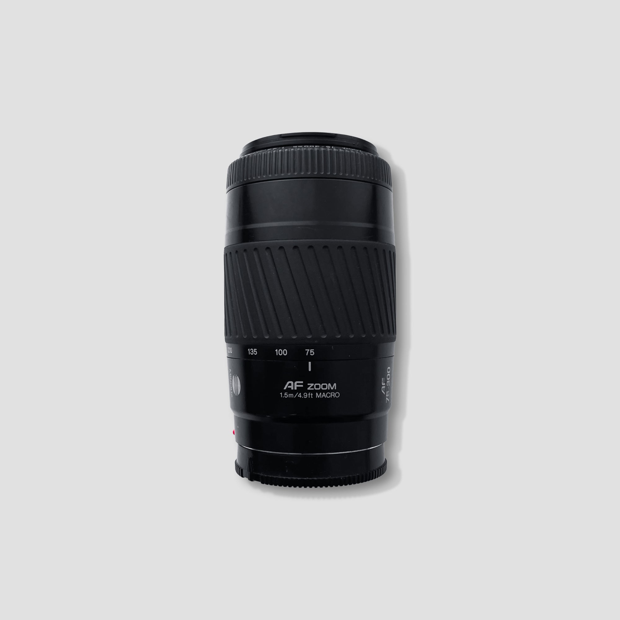 Minolta AF 75-300mm lens mounted on camera with zoom controls visible