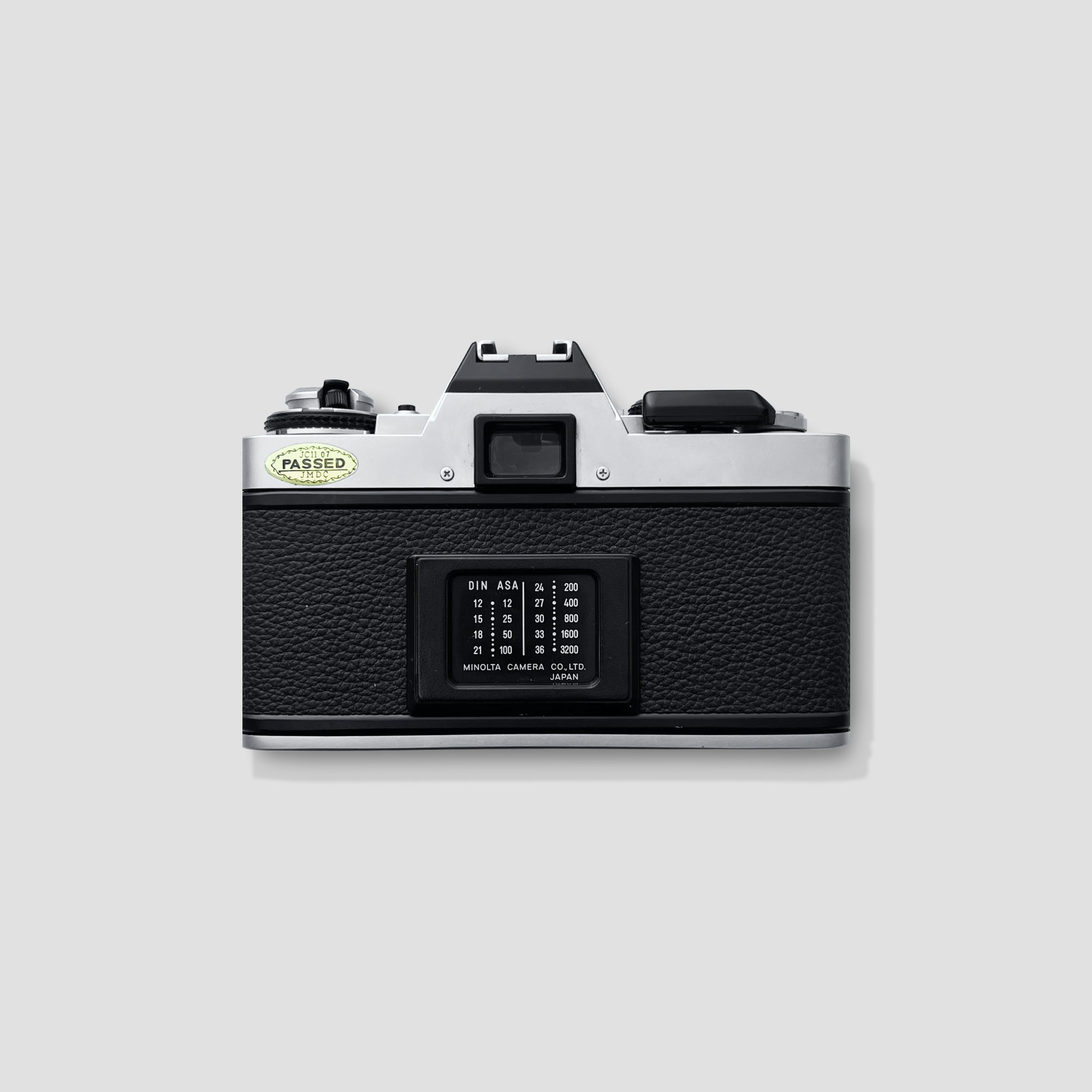 Minolta XG-M 35mm film camera in natural light, illustrating its vintage charm and aesthetic appeal.