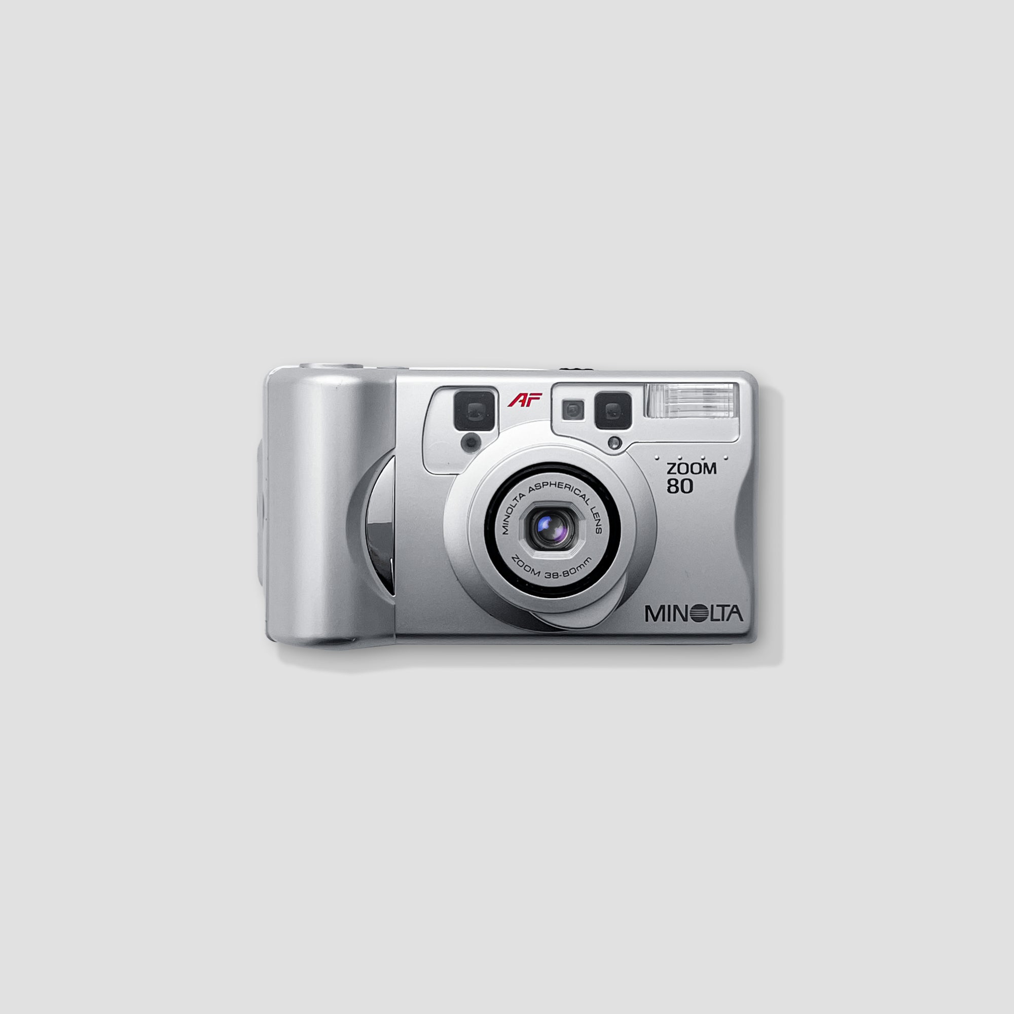 Minolta Riva Zoom 80 camera from the side, highlighting its compact size and retro styling.